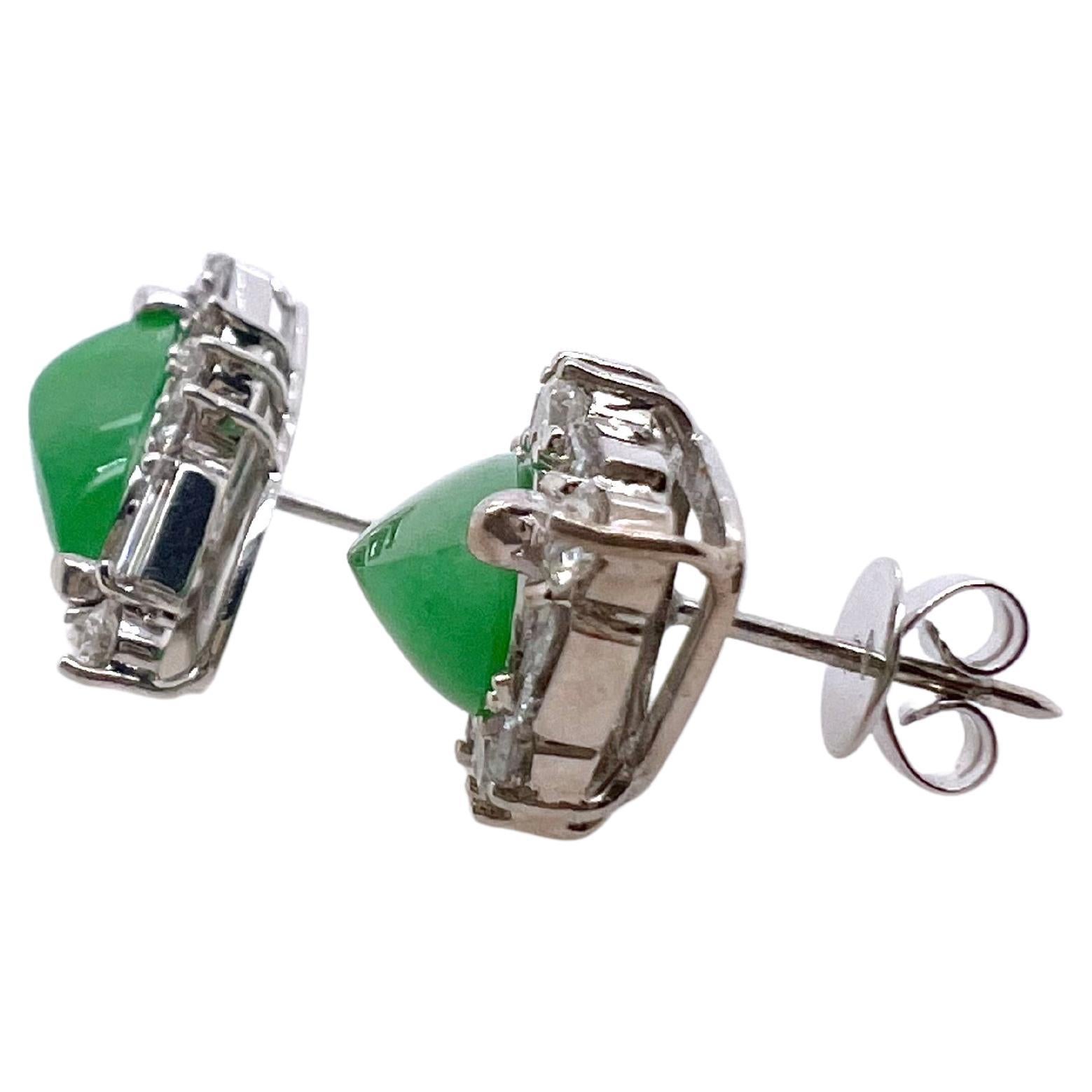 This gorgeous pair of free form GIA Certified natural Jadeite earrings are handmade with baguettes and rounds.  The shape of the earring is made to keep the same pattern as the free form Jadeite.  The beautiful apple green color matches well and is