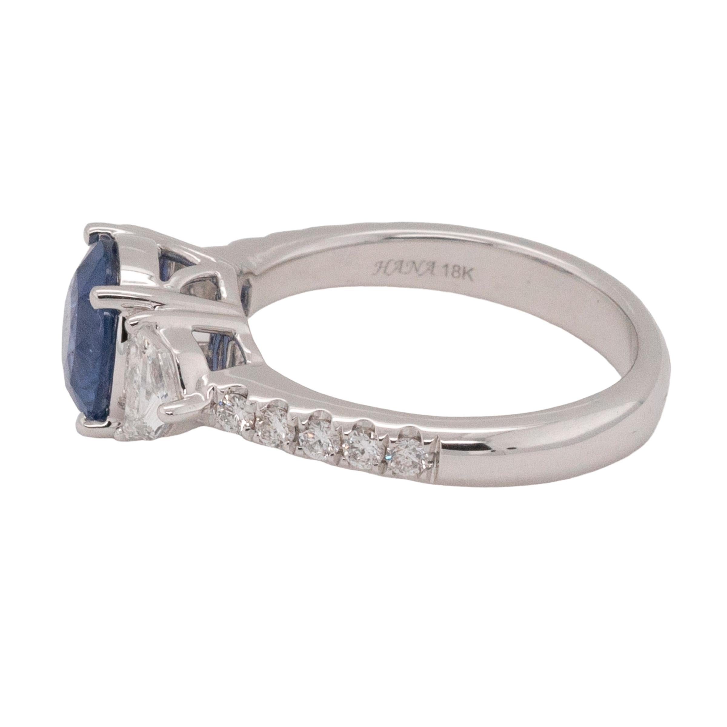 A testament to masterful craftsmanship, this enchanting ring is crafted in 18k white gold and features a dazzling combination of diamonds and a certified heated sapphire. The centerpiece is a GIA-certified 4.58-carat oval-cut heated sapphire from