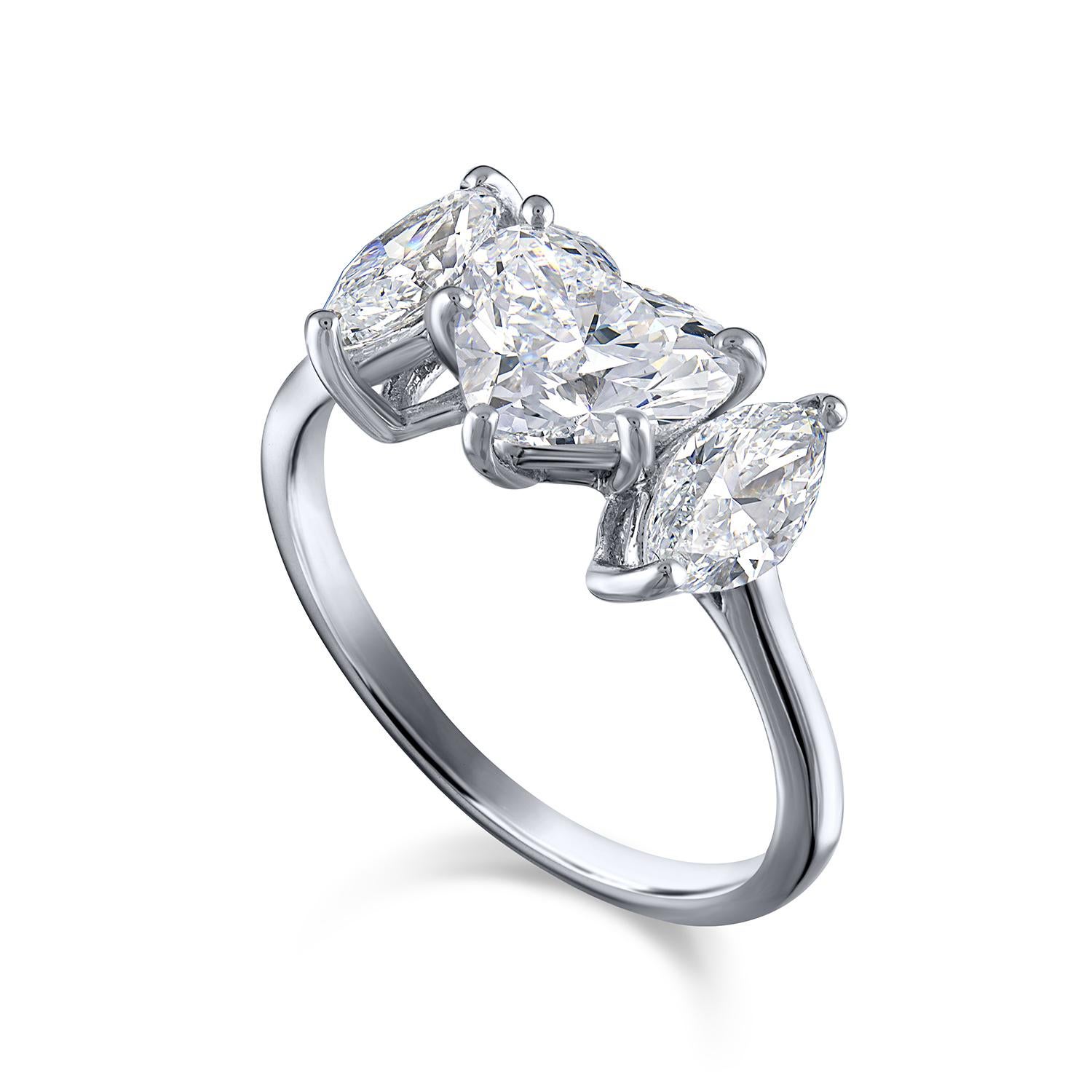 This elegant ring features a 1.54-carat natural heart shaped brilliant diamond as its centerpiece, surrounded by additional oval and heart shaped brilliant diamonds, bringing the total carat weight to 2.56 carats. The primary diamond is GIA