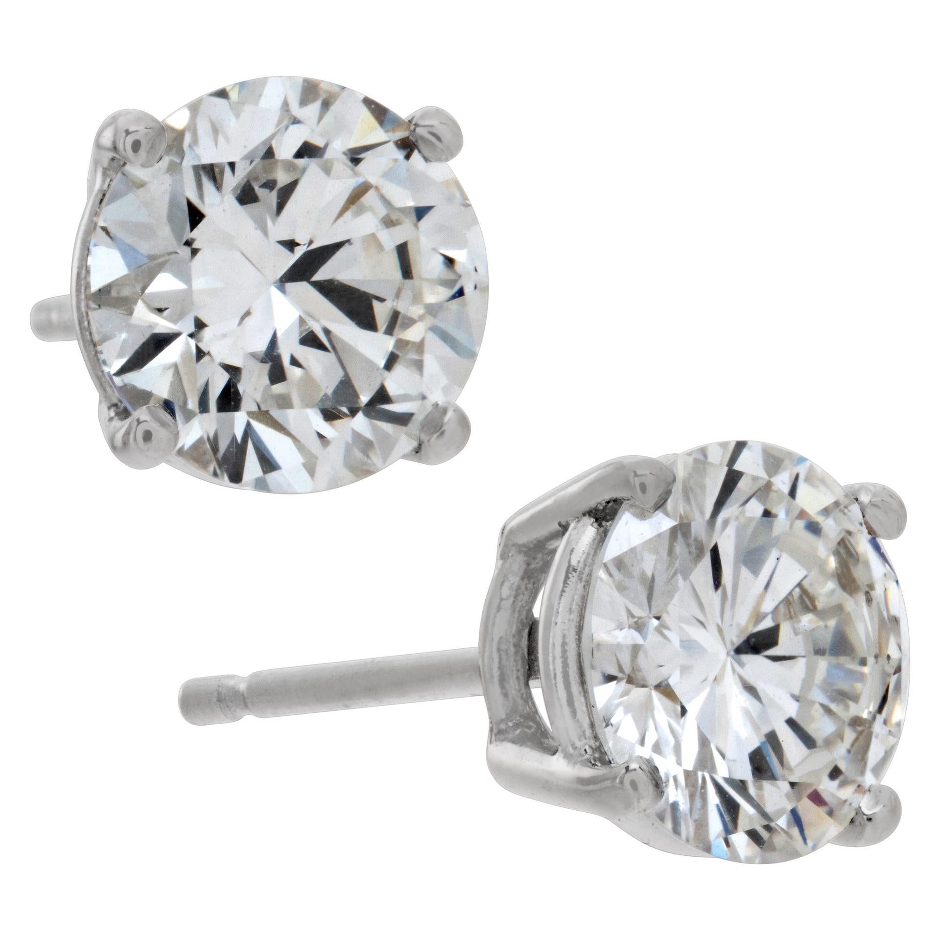GIA certified Round Brilliand Cut diamond studs 1.04 ct. and 1.03 ct. both G color, VVS2 clarity. 18K white gold 4 prong settings.
