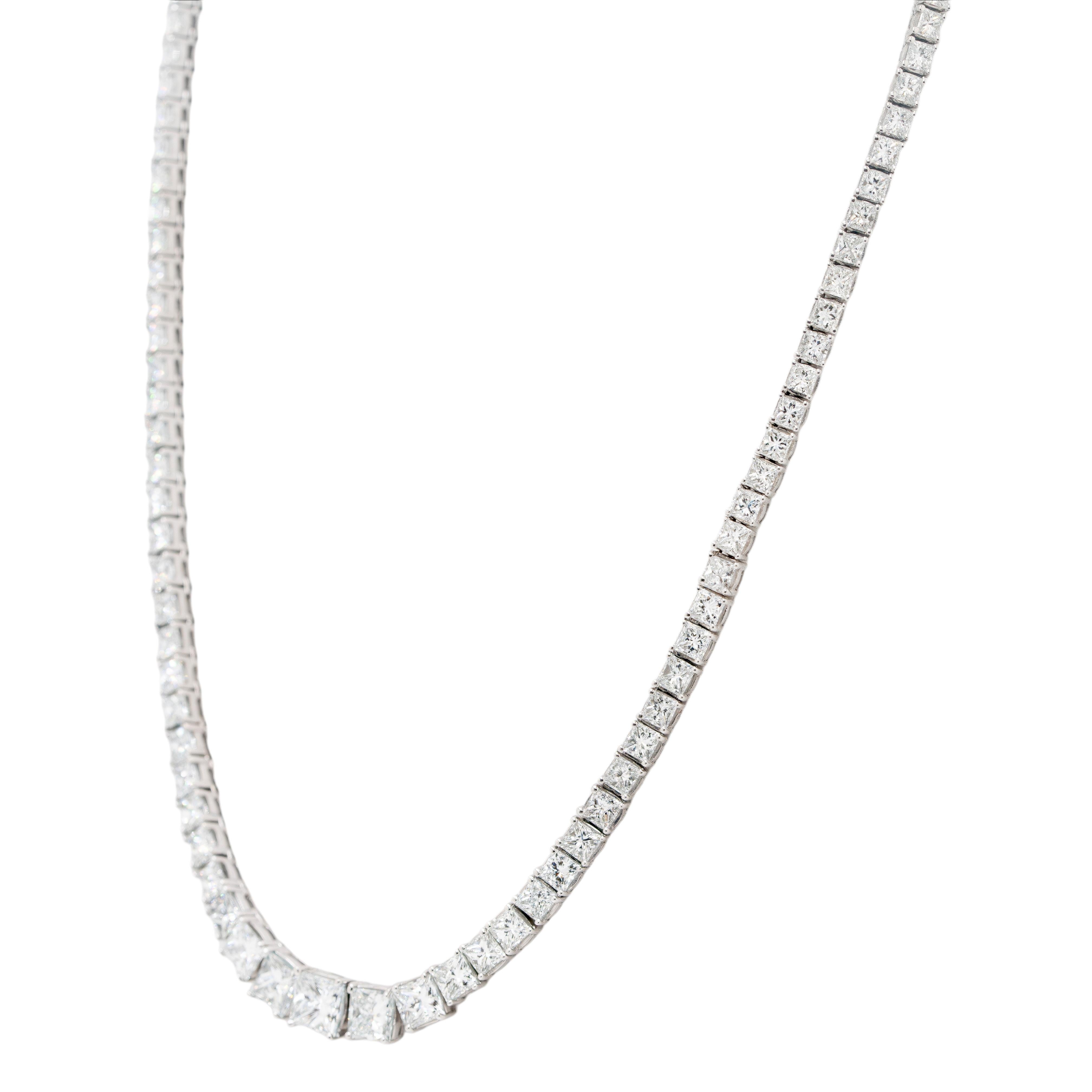 This stunning 18k white gold graduated tennis necklace is a masterpiece of elegance and refinement. Adorned with approximately 19.06 carats of natural princess cut diamonds, this piece exudes exceptional brilliance and luxury. The diamonds are