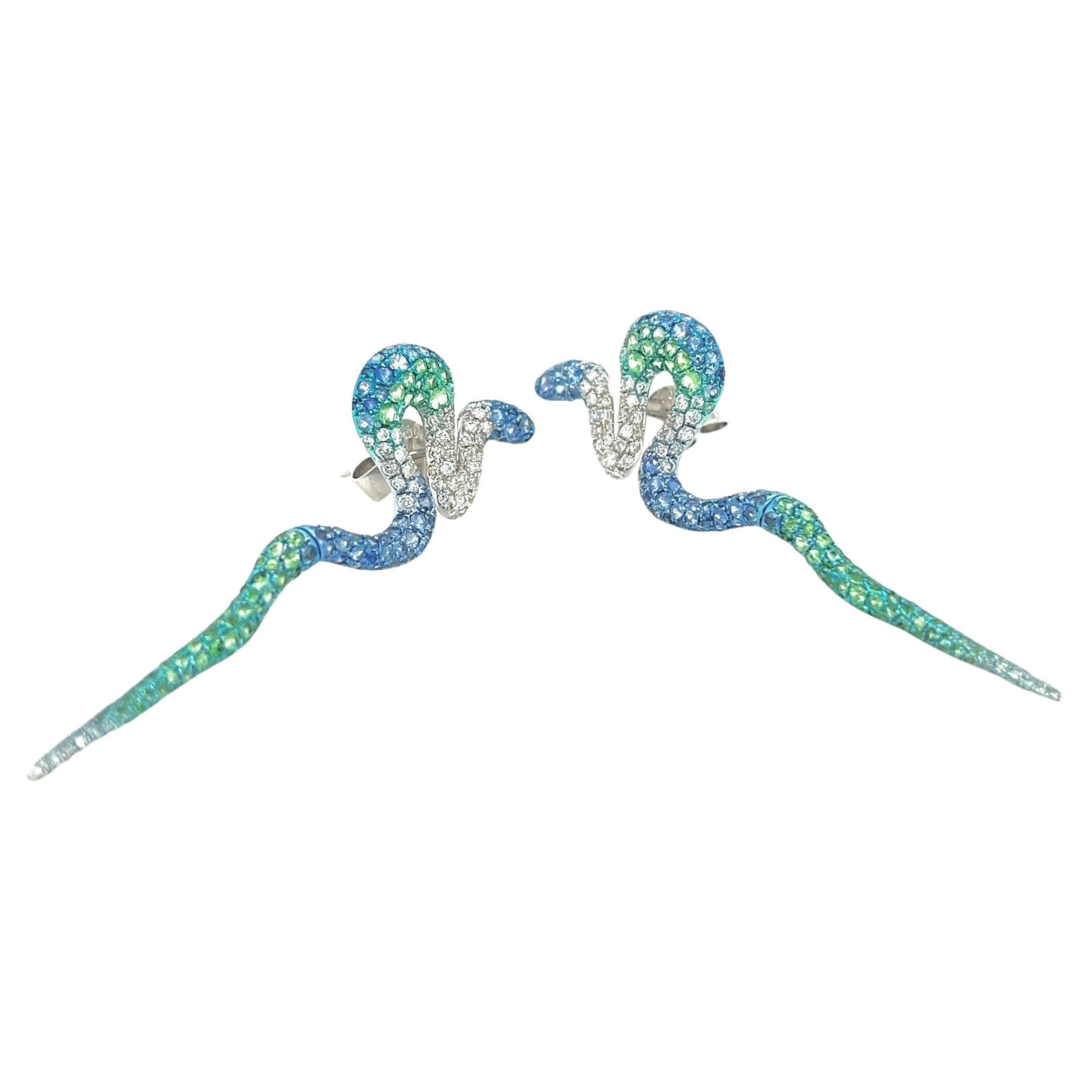 18K White Gold Green Garnet & Sapphire Earrings with Diamonds

144 Blue Sapphires - 1.65 CT
144 Diamonds - 0.80 CT
152 Green Garnets - 1.26 CT
18K White Gold - 6.69 GM

These stunning 18K white gold earrings feature a total of 144 blue sapphires,