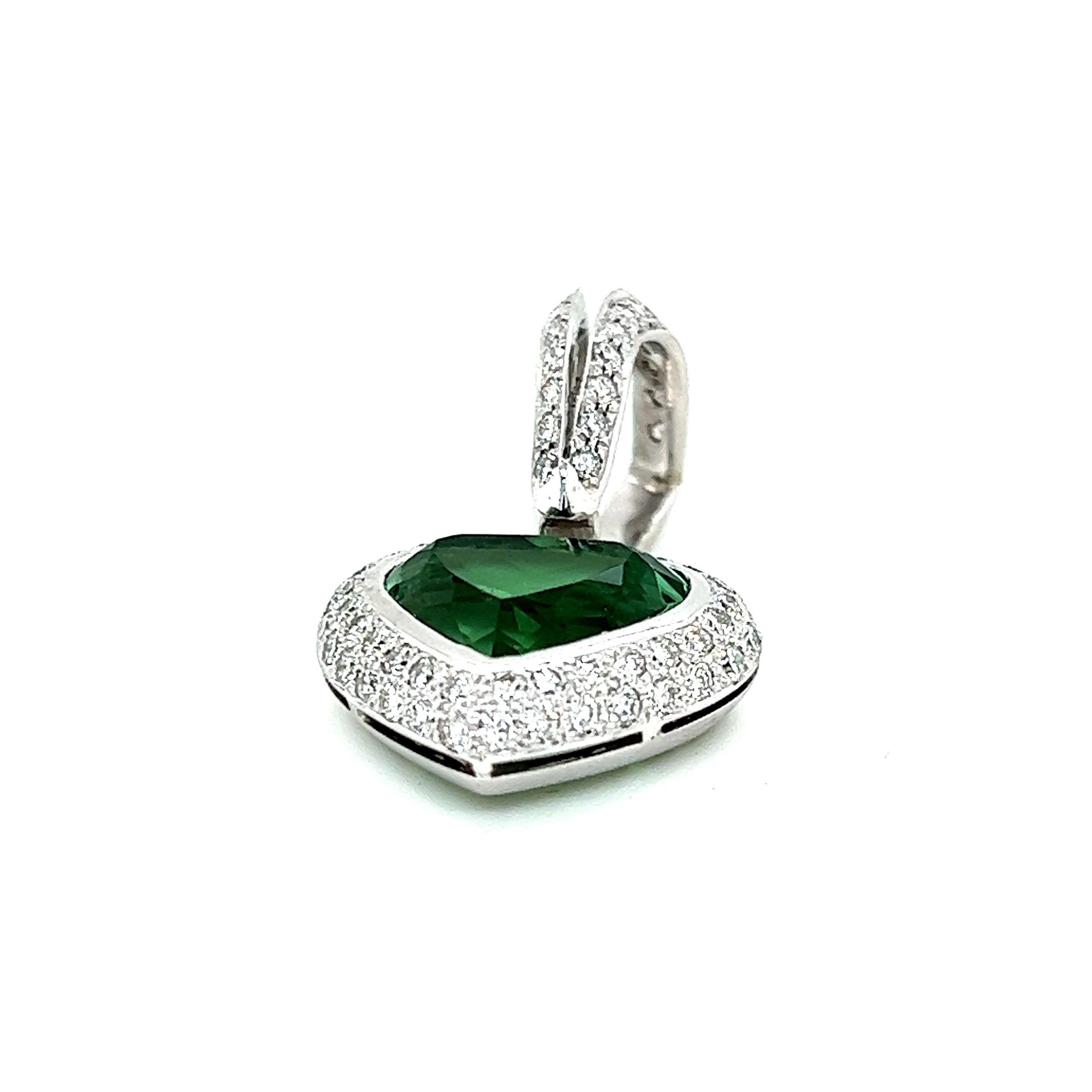 18k White Gold Green Tourmaline and Diamond Heart Pendant.

Height of the pendant with bail approx. 32mm
Width approx. 18.20mm
Green tourmaline heart approx. 12.32x10.5mm
