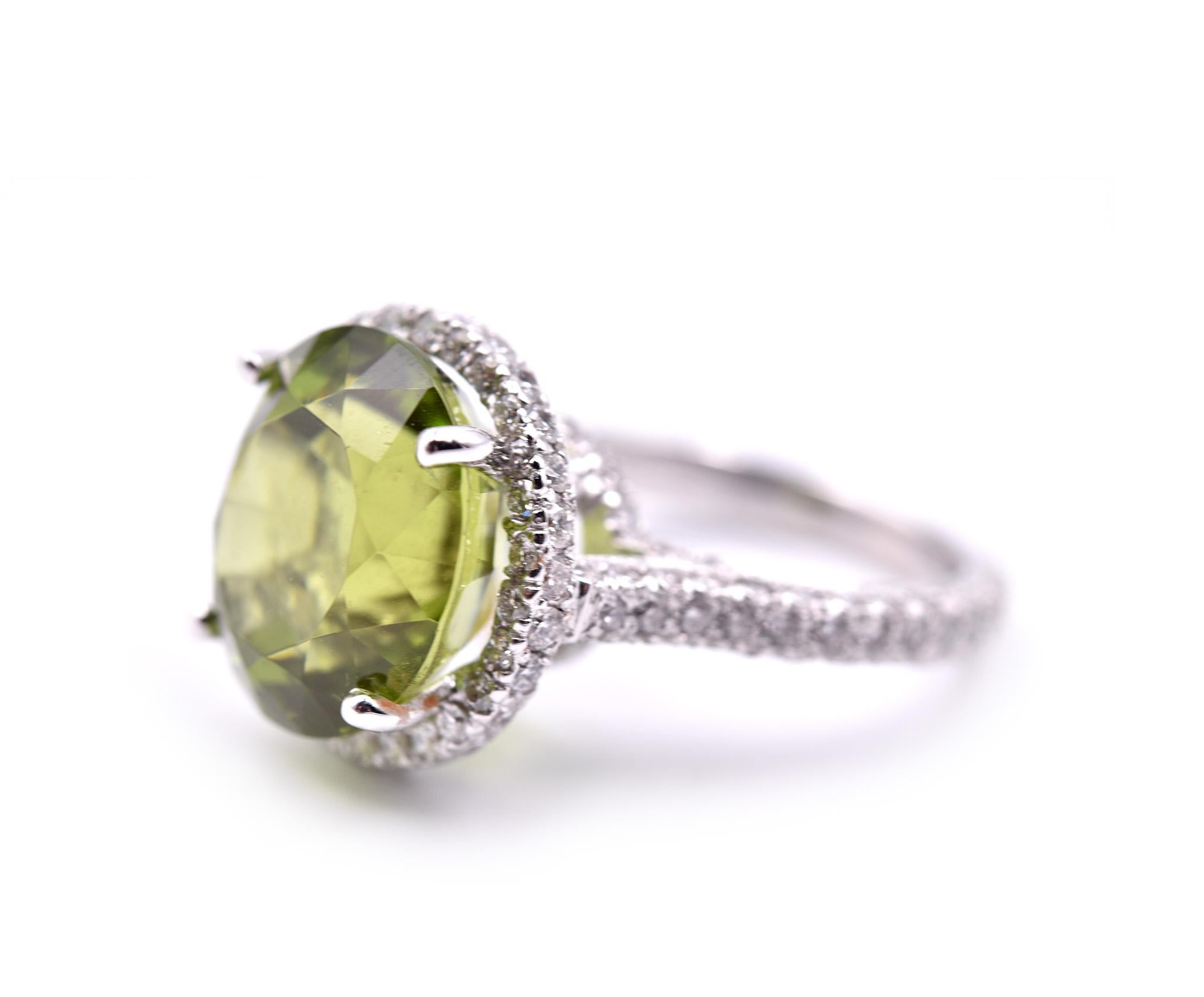 Designer: custom design
Material: 18k white gold
Green Tourmaline: round faceted = 11.96cttw
Diamond: 120 round brilliant = 2.50cttw 
Dimensions: ring has a diameter of 15.76mm
Ring Size: 6 ½ (please allow two extra shipping days for sizing