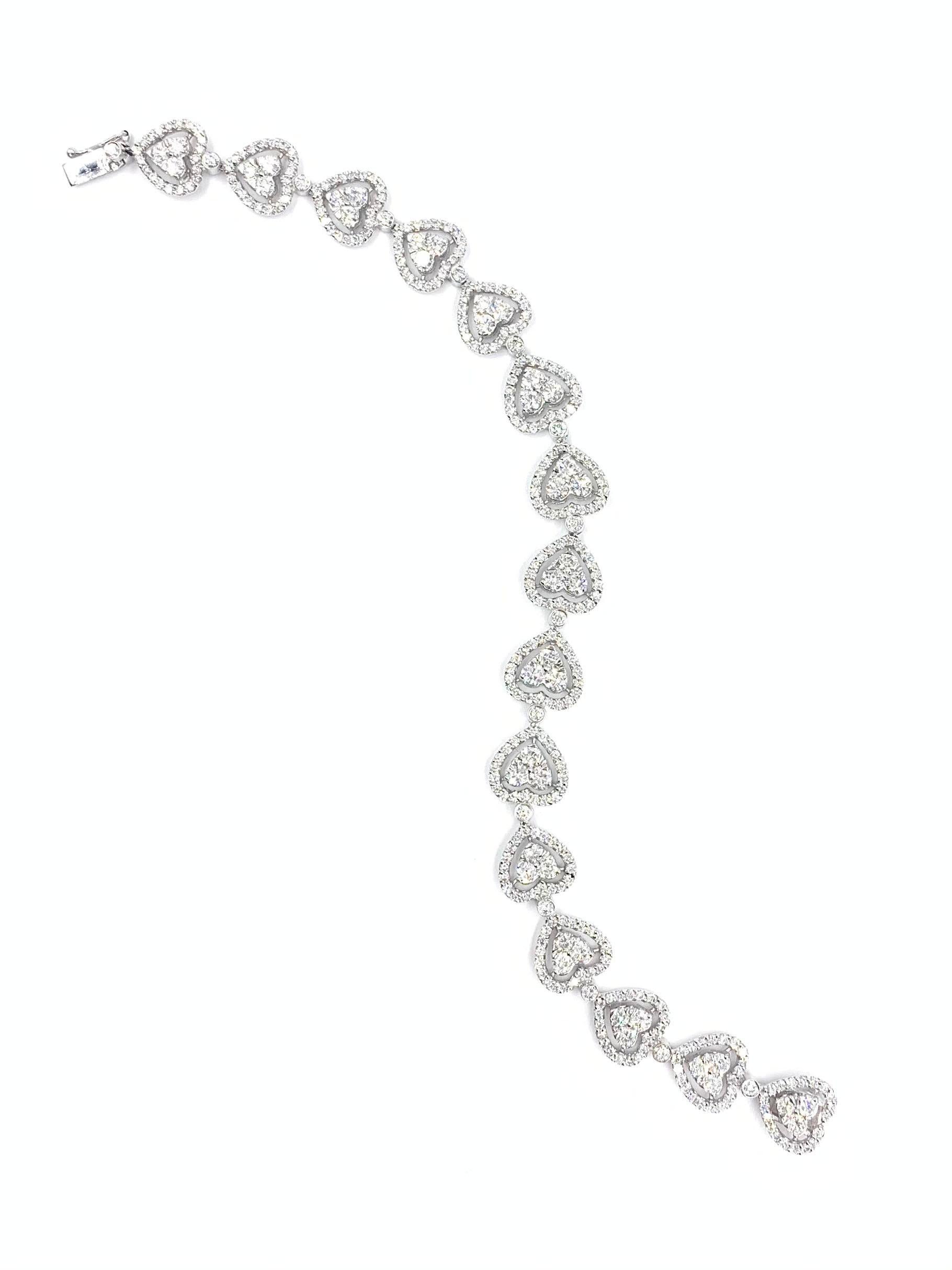 Made with superior craftsmanship by Gregg Ruth. This sparkling 18k white gold bracelet is adorned with 360 round brilliant diamonds at 6.18 carats total weight. Diamond quality is approximately F-G color, VS1-VS2 clarity. Fastens securely closed