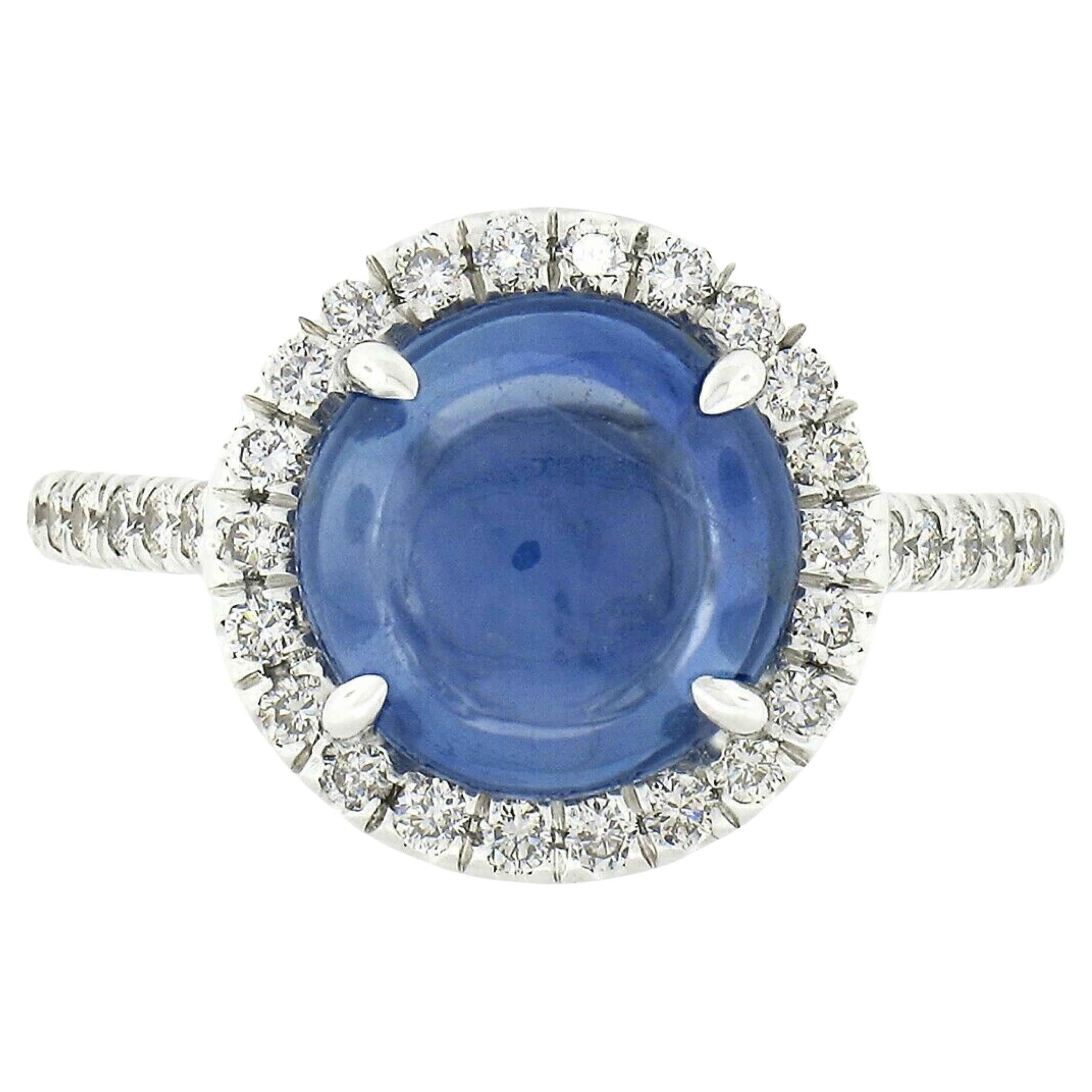 18k White Gold Gubelin Round Cabochon Ceylon Sapphire & 0.63ct Diamond Halo Ring