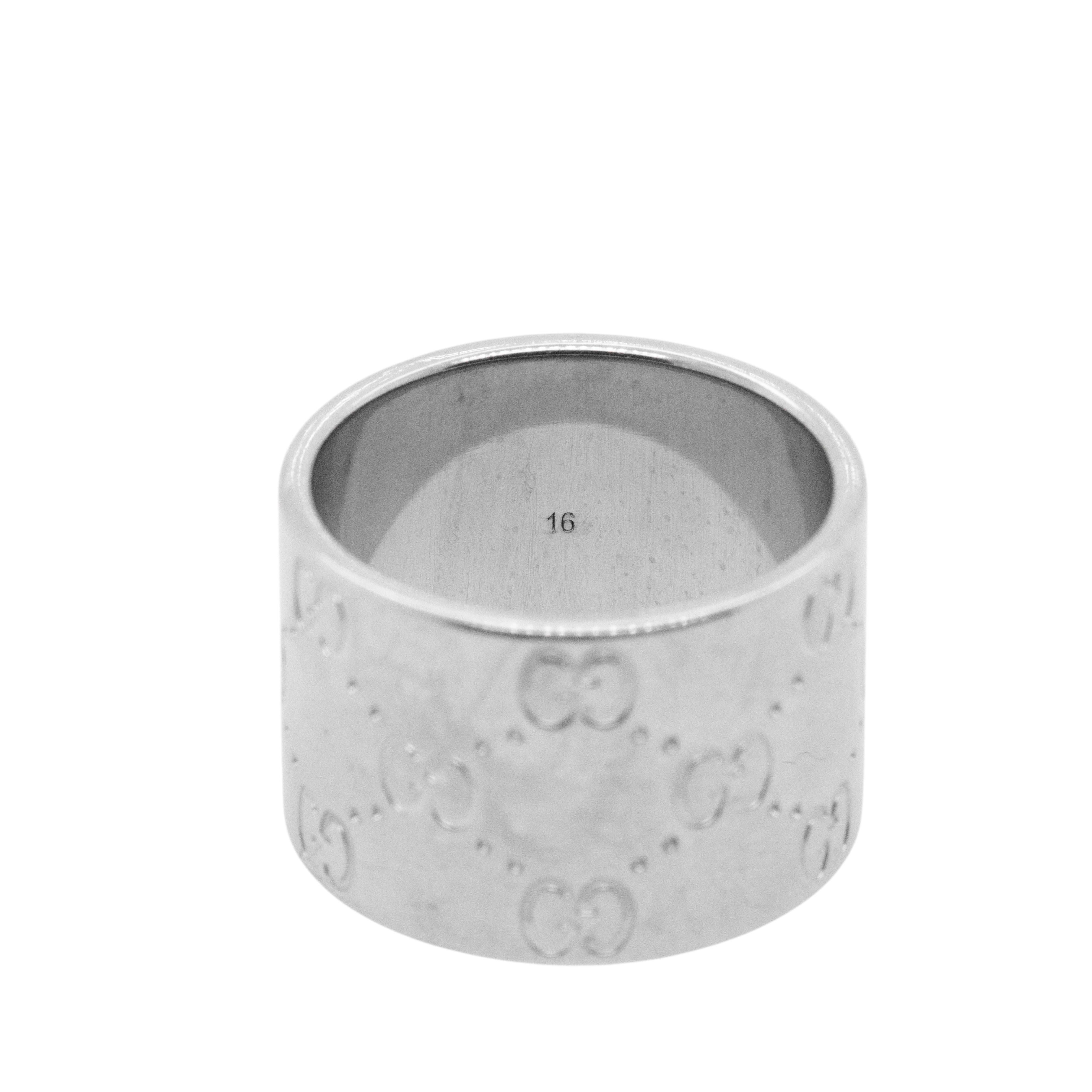 Elevate your style with this exquisite 18K White Gold Gucci Mono Ring, a stunning piece that embodies the perfect fusion of luxury and contemporary design. With a substantial wide band weighing 16.2 grams (10.4 dwt), this ring is not only a