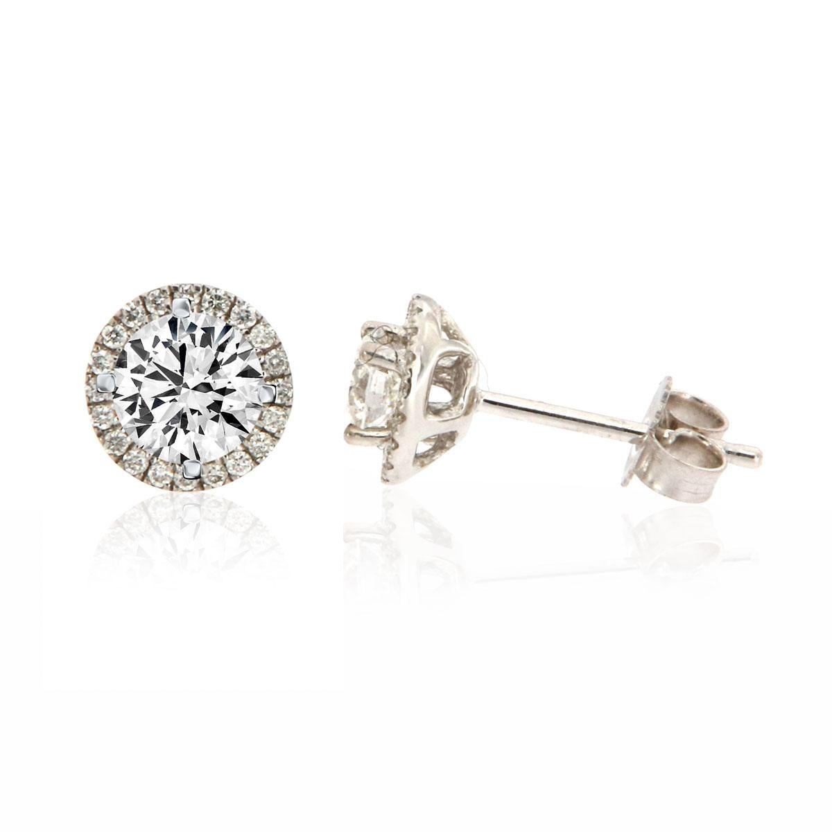 These sparkling halo earrings feature 0.60-carat diamonds in a four-prong setting, surrounded by a brilliant halo of micro-prongs diamond accents in 0.15 carat TW. Experience the Difference!

Product details: 

Center Gemstone Type: NATURAL