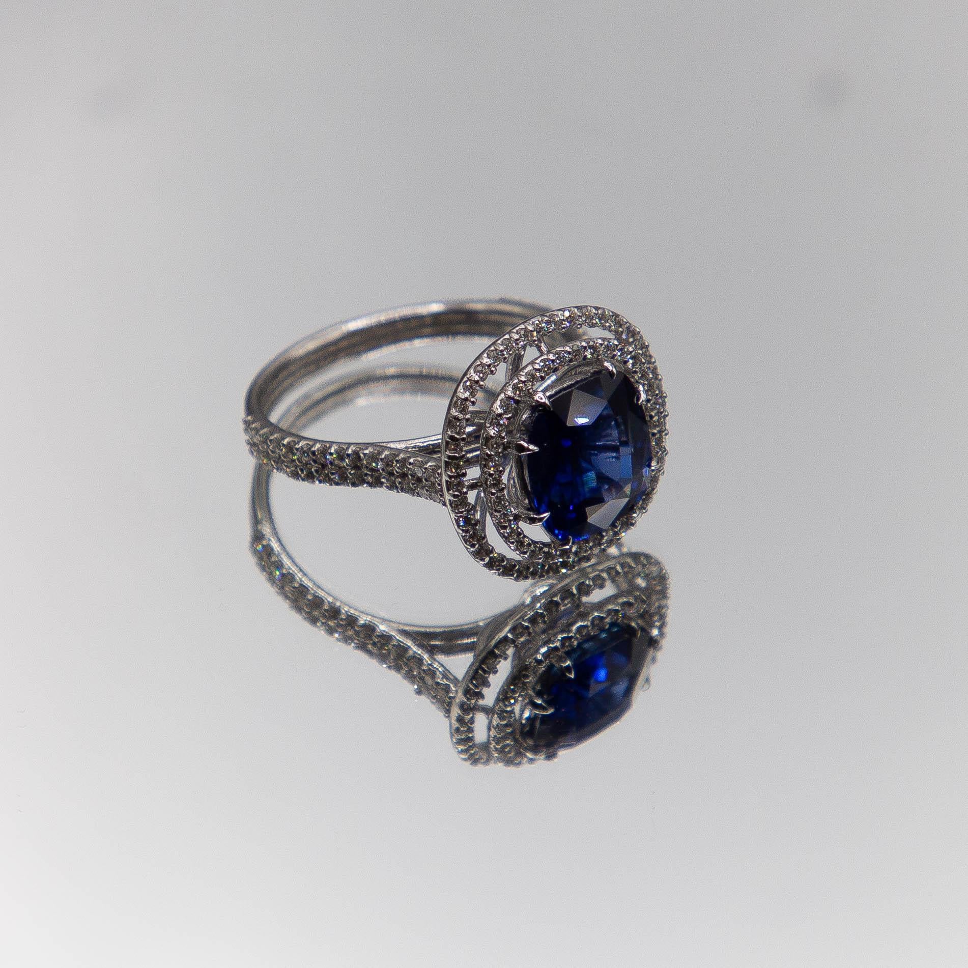 18k White Gold Halo/ Intense Blue Sapphire 6.39 Carats/ 132 Diamonds 0.66 Cts For Sale 2