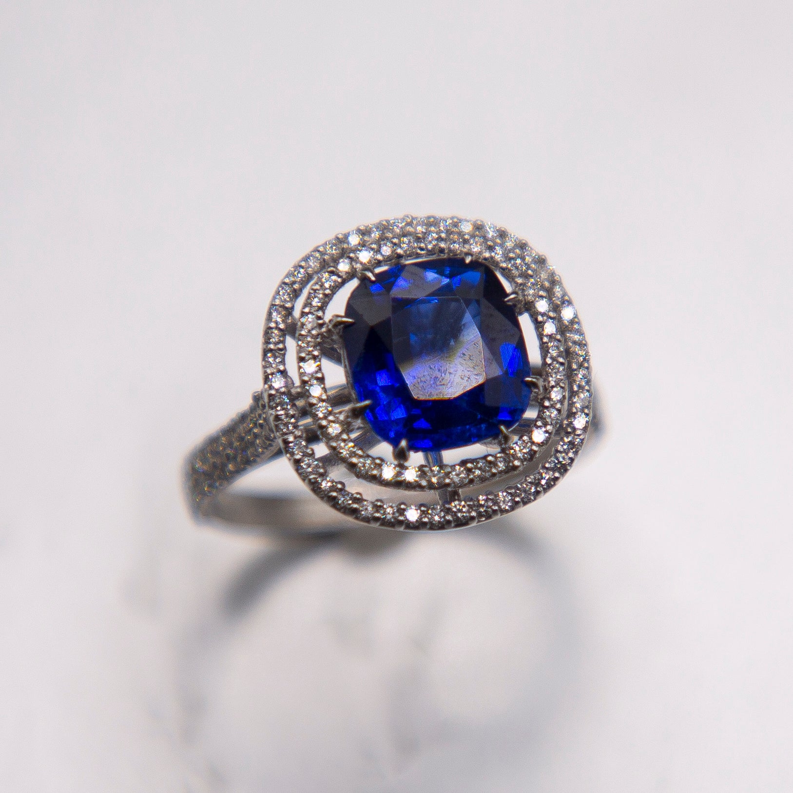 18k White Gold Halo/ Intense Blue Sapphire 6.39 Carats/ 132 Diamonds 0.66 Cts For Sale