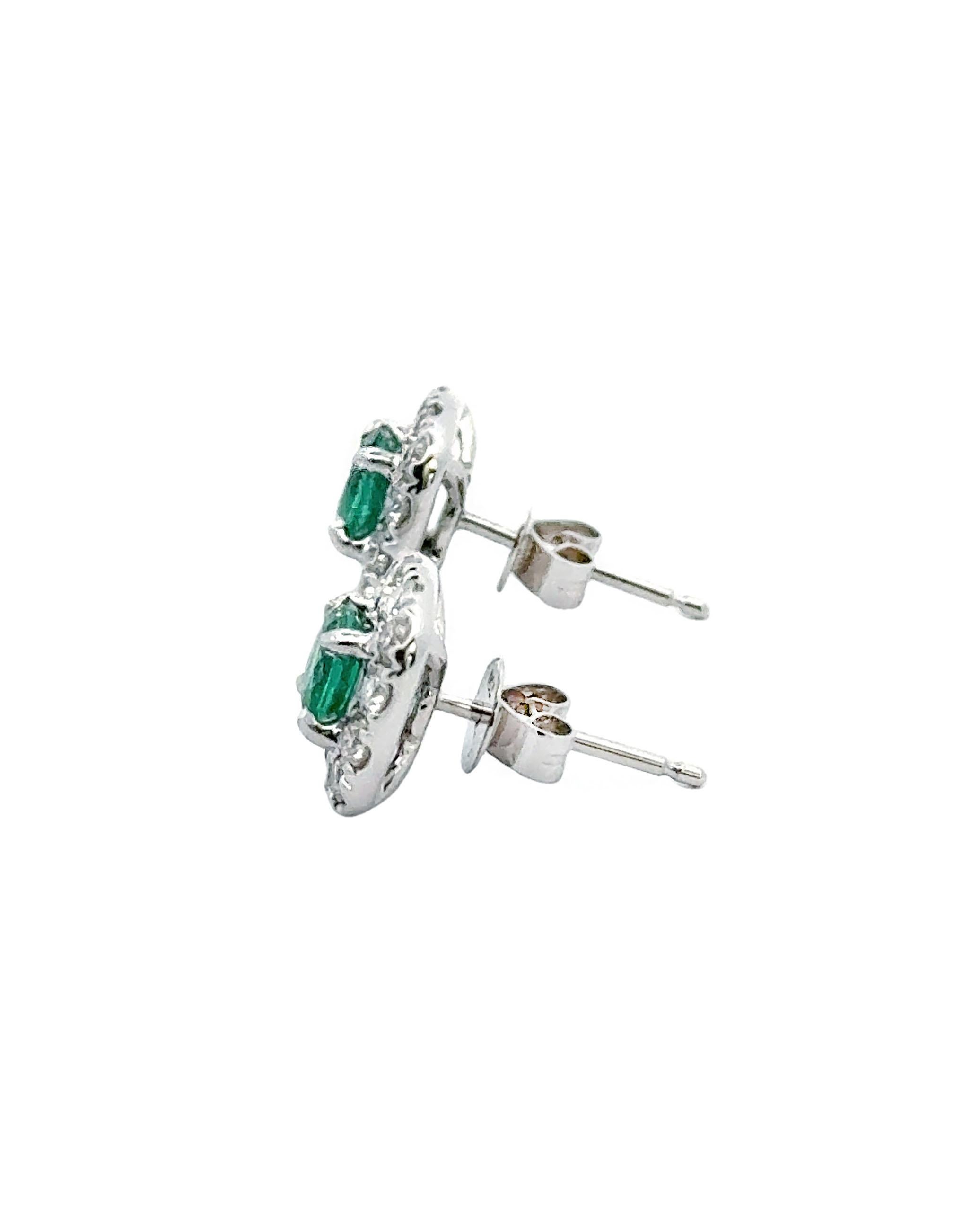 Contemporary 18K White Gold Halo Style Earrings with Emeralds and Diamonds For Sale