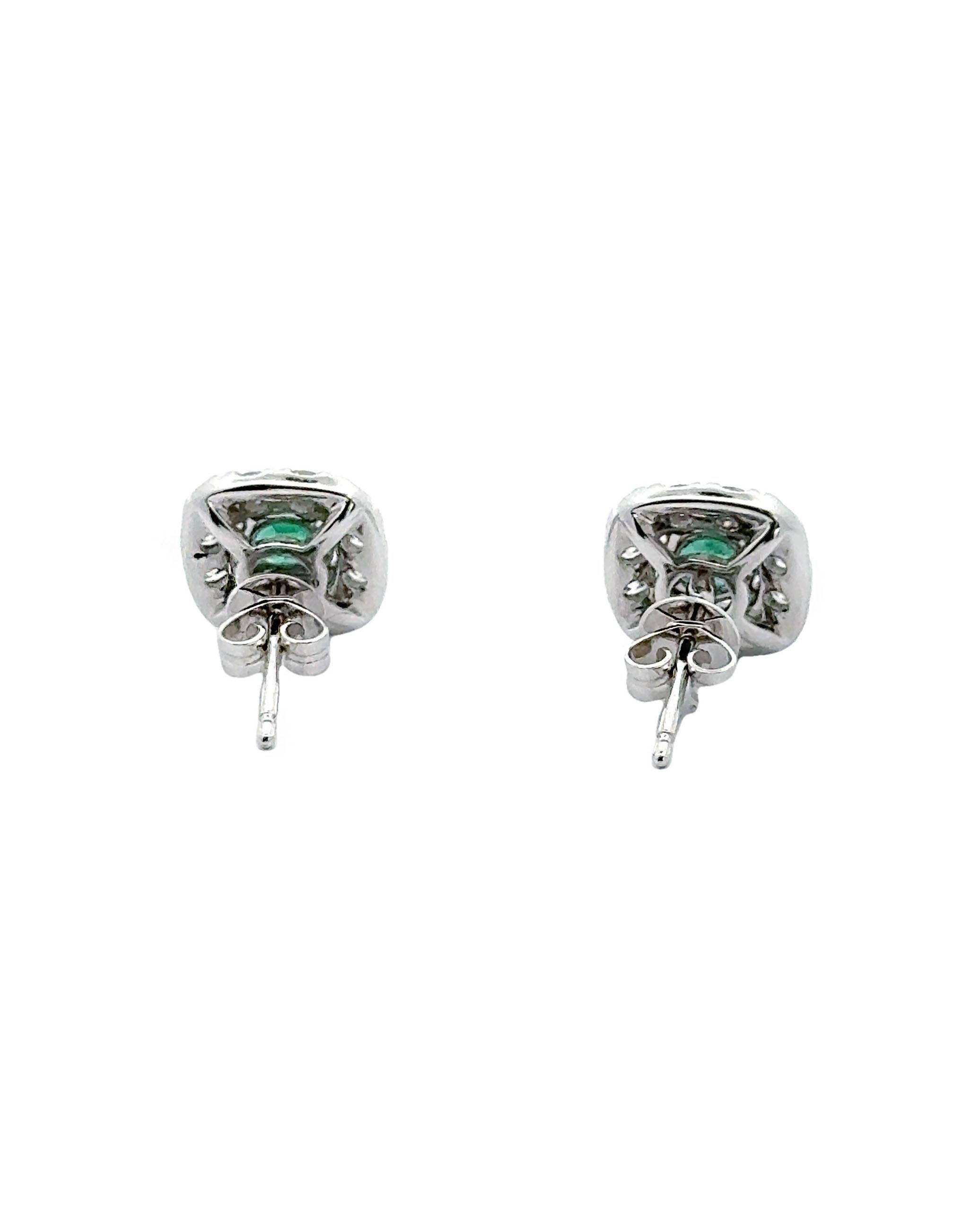 Round Cut 18K White Gold Halo Style Earrings with Emeralds and Diamonds For Sale