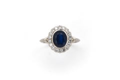 18k white gold handmade Sapphire and Diamond Princess Diana entourage ring.