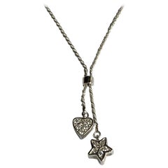 18 Karat White Gold Heart and Star 0.12 Carat Diamond Pendant
