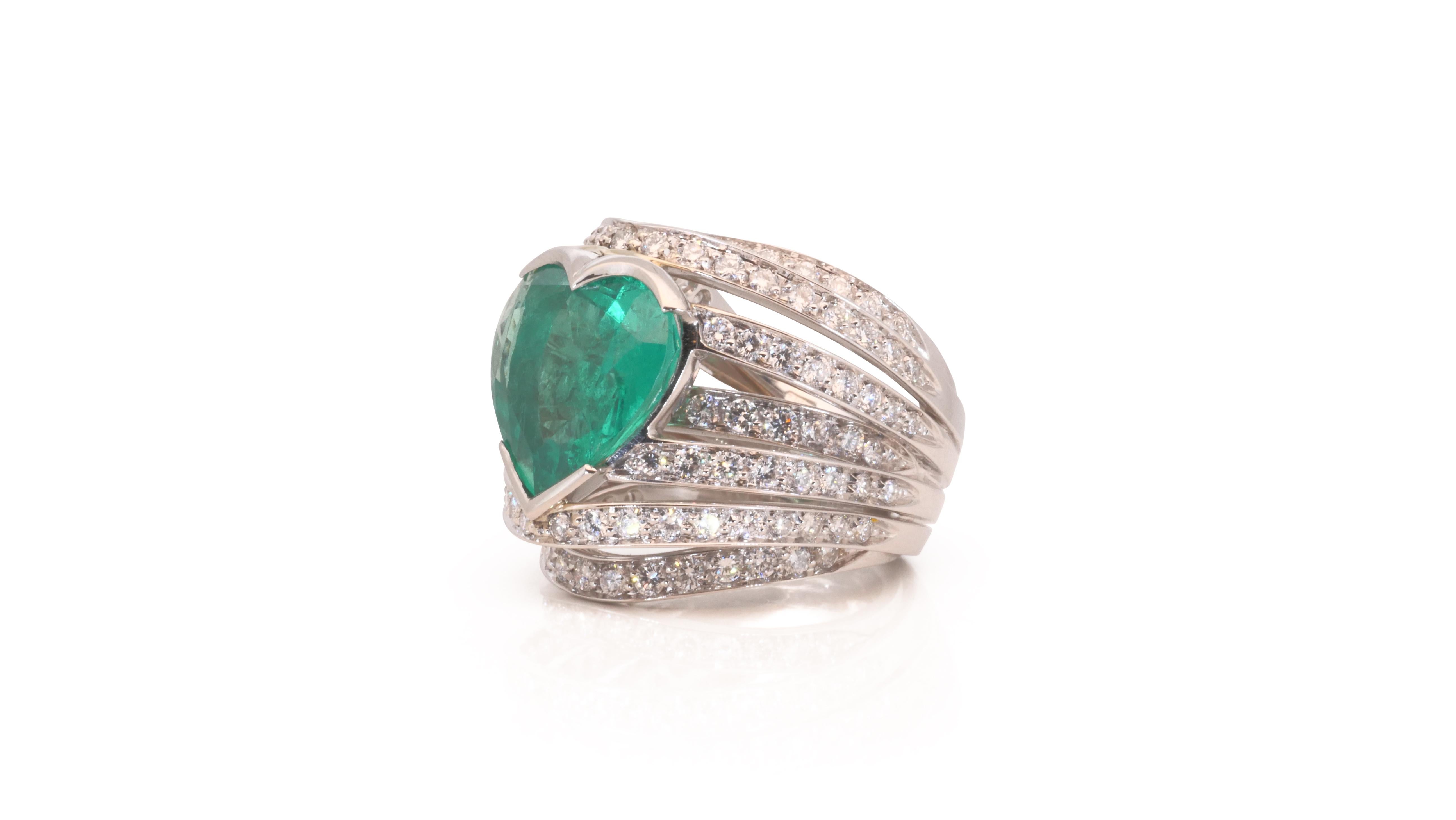 A gorgeous heart dome ring with a dazzling 6.5 carat heart natural emerald. It has 2.01 carat of side diamonds which add more to its elegance. The jewelry is made of 18k white gold with a high quality polish. It comes with GRS certificate and a