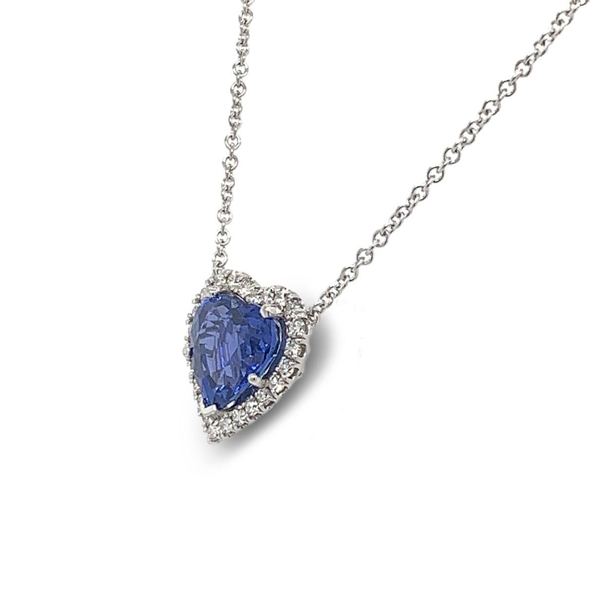 These extraordinary hand crafted 18k white gold pendant features preminum quality 5.10 Carat Heart Shape Blue Sapphire GIA certified,  framed in a halo of 0.40 carat total weight of brilliant diamonds. This pendant is ideal for special occasions.