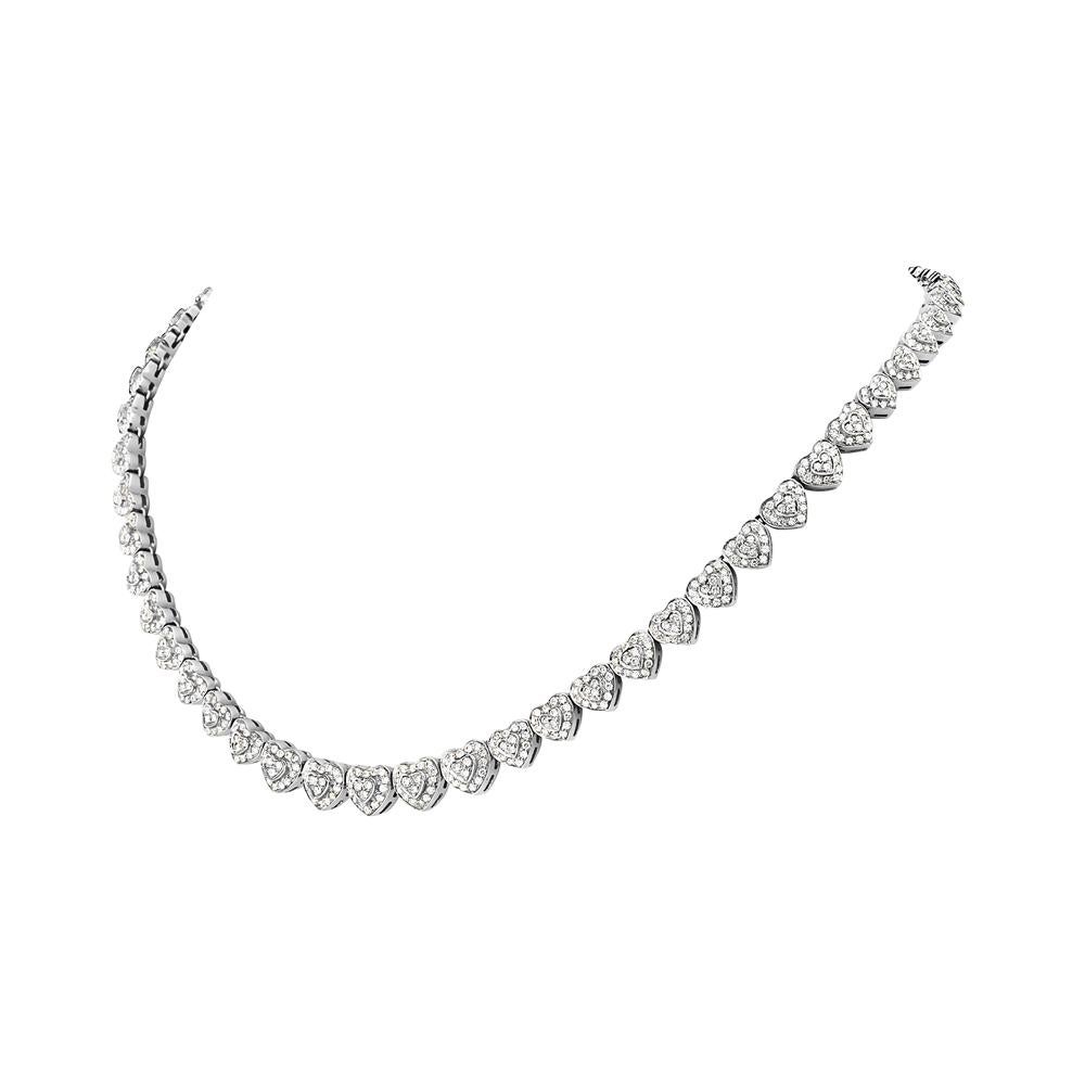This riviera necklace features 6.84 carats of round F-G VS pave diamonds fashioned into heart shapes. 44.8 grams total weight. 7.5 inch chain drop. 

Viewings available in our NYC showroom by appointment.