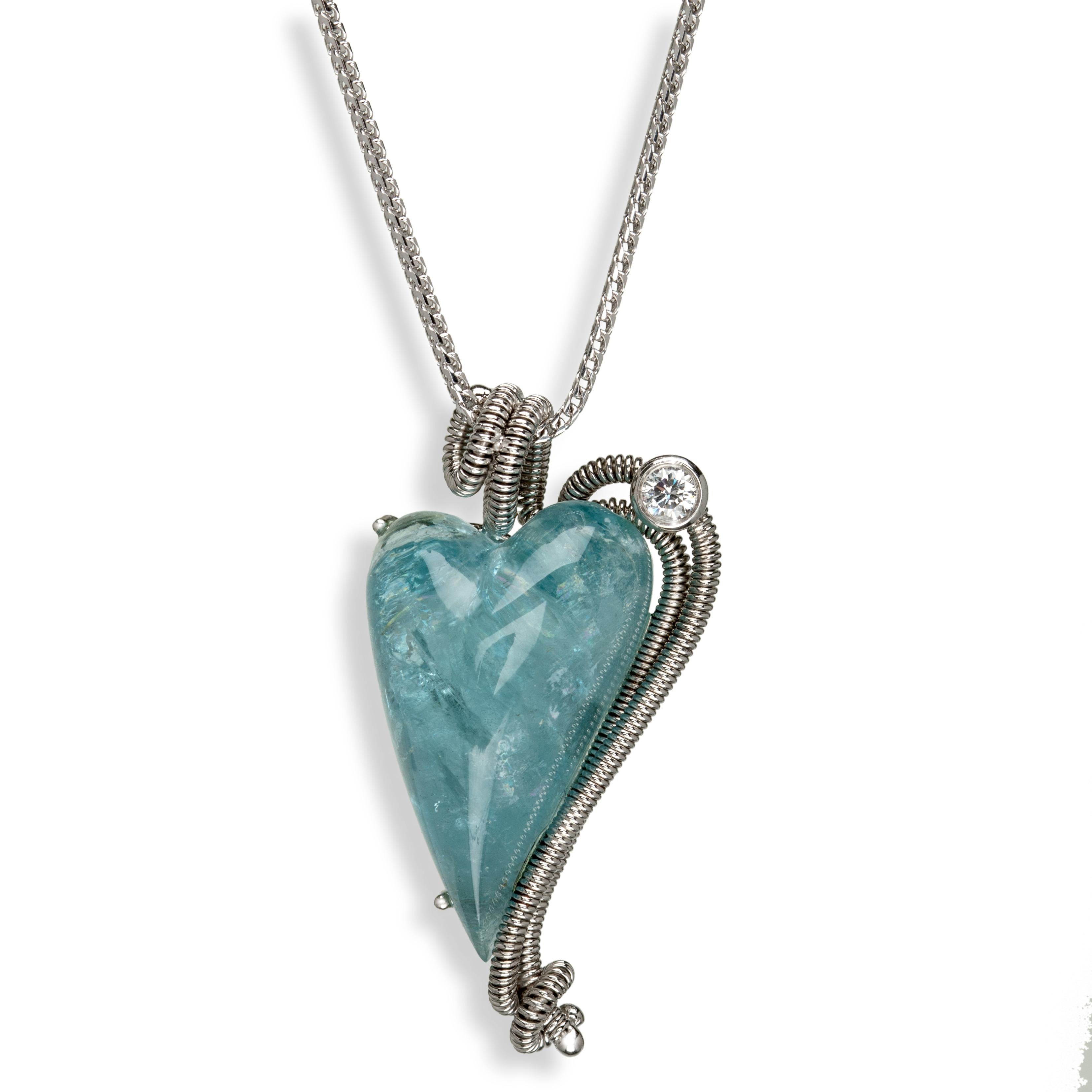 The shape of your heart is unmistakable in this visually appealing heart shaped aquamarine cabochon stone, set in Gloria’s signature coil work made from 18k white gold and beset with a sparkling diamond for added shine. What better way to say I love