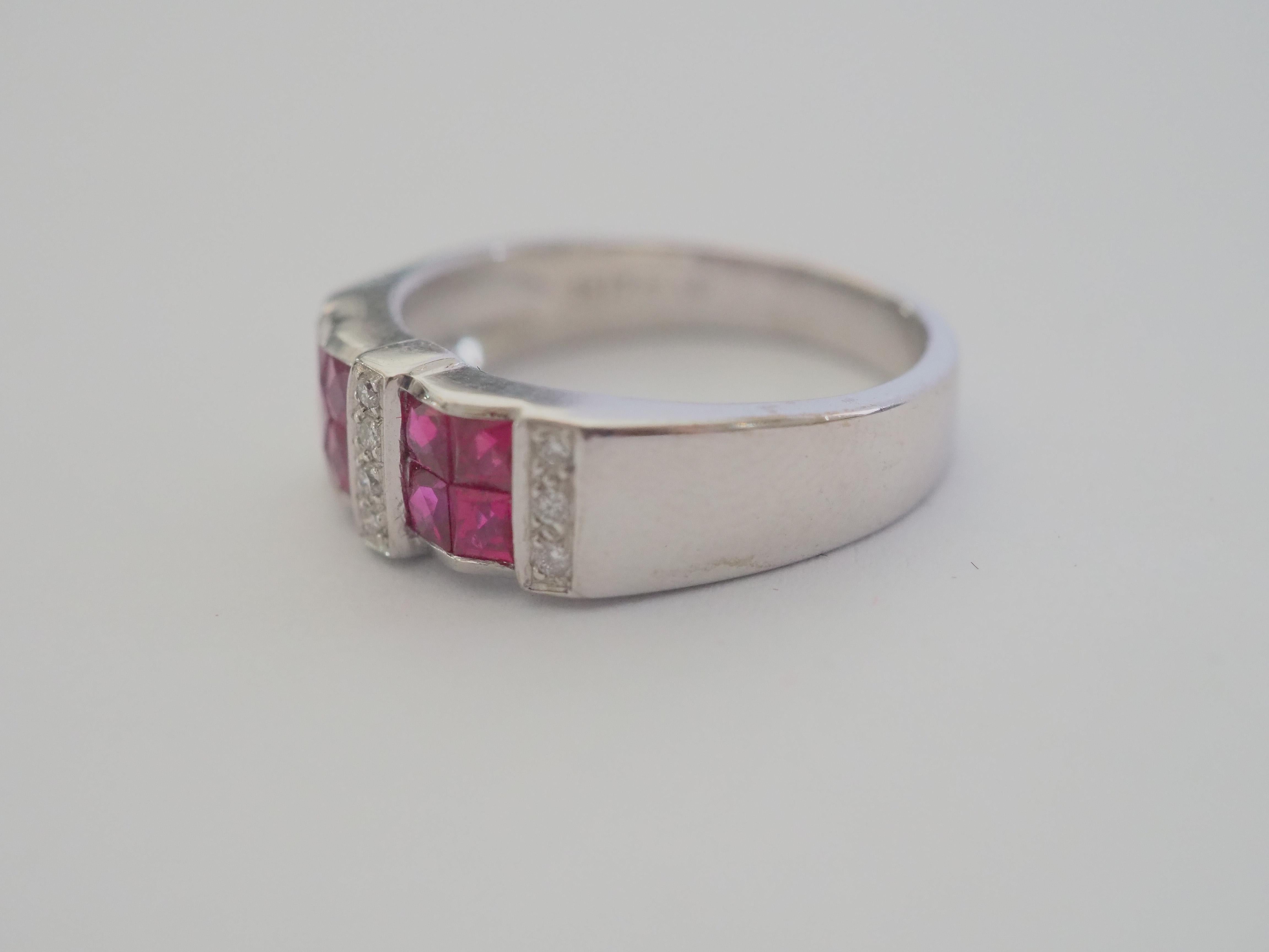 A gorgeous luxury Neo-vintage chunky band ring that is both suitable for all sexes. This ring has two rows of beautiful Thai rubies and pave round diamonds channeled nicely into the band. The square cut rubies have a beautiful pinkish red hue. And