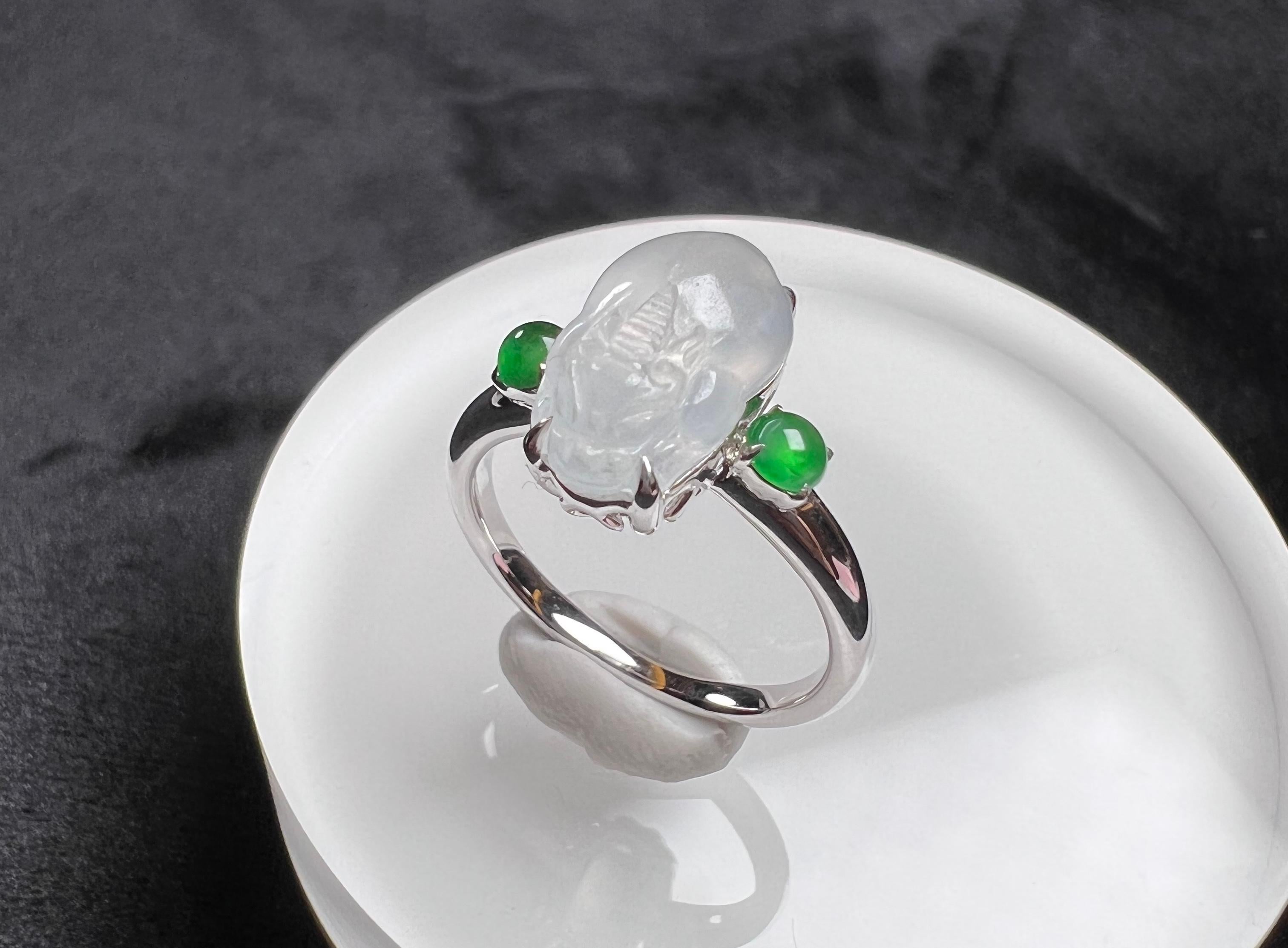 18K White Gold Icy Jadeite Green Jadeite Mythical Creature Ring, Cocktail Ring

Total weight (approx.): 3.8g 
Icy jadeite measurement (approx.): 12.9*7.6mm
Green jadeite measurement (approx.): 3.2*3.2mm

This ring is resizable.
Get in touch with us