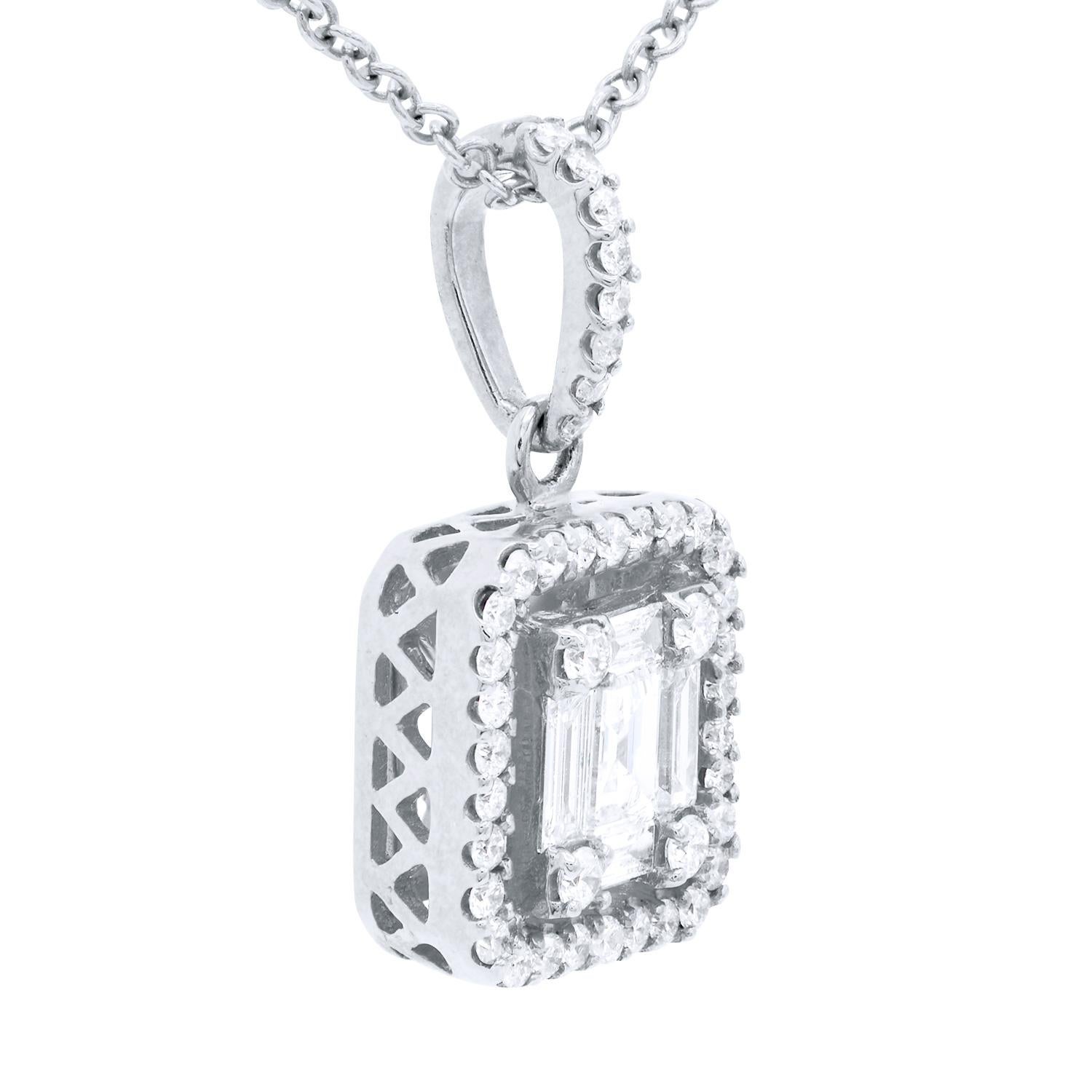 This unique and beautiful pendant looks like an emerald-cut diamond but is actually made of smaller diamonds to appear in an emerald shape. It is then surrounded by a round diamond halo and hung from a diamond-covered bail. There are 5 baguette