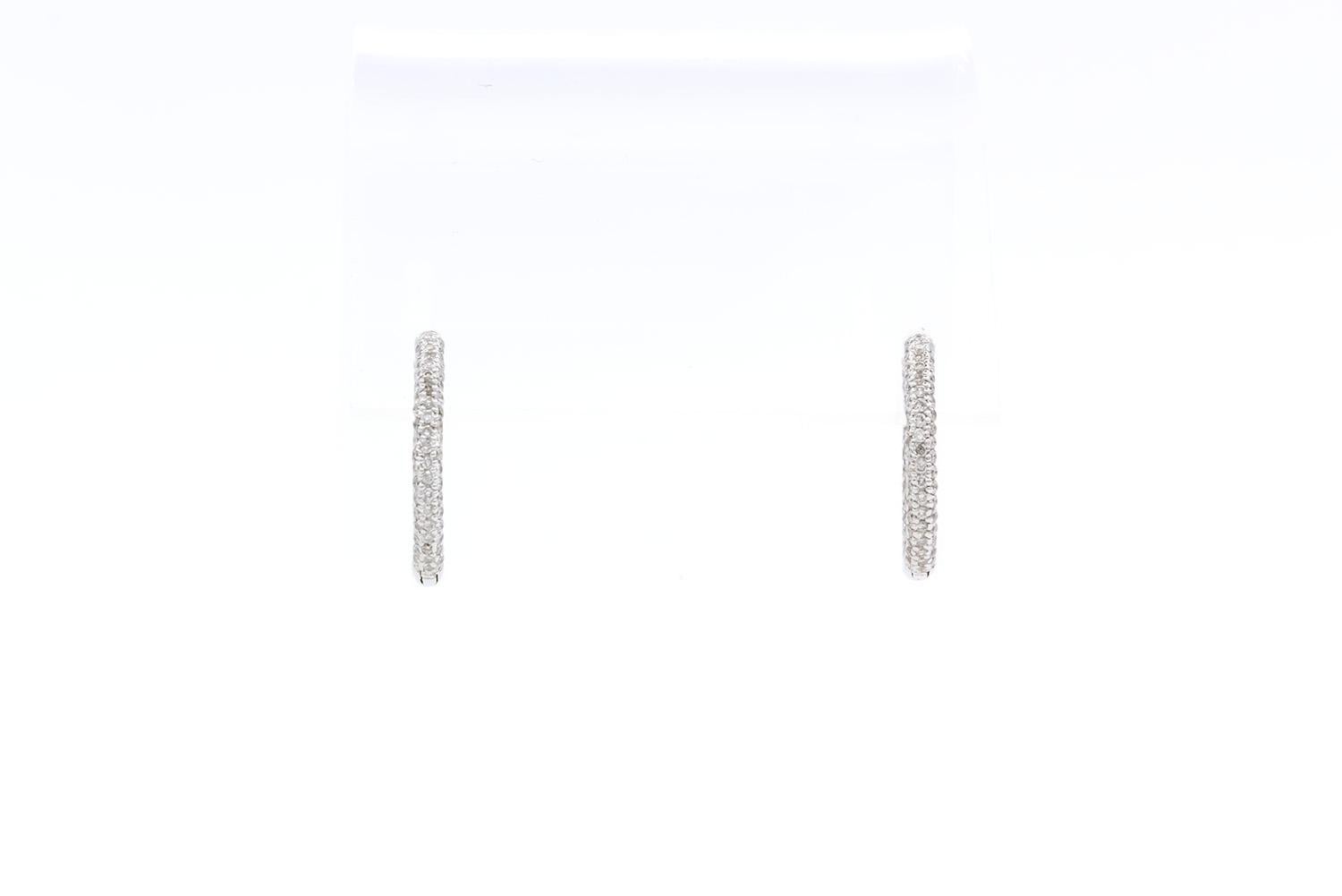 We are pleased to present these 18K White Gold & Inside Outside Diamond Hoop Earrings. These beautiful earrings feature an estimated 2.04ctw G-H/VS-SI Round Brilliant Cut Diamonds set in 18k White Gold 3/4