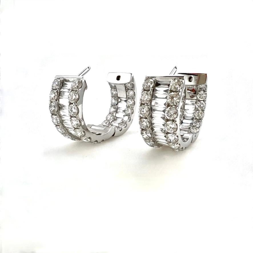 Beautiful hoop earrings featuring round brilliant cuts and baguette diamonds in 18k white gold.     These immaculate inside outside hoop earrings are a perfect accessory for the smart casual look!  These are a must for everyone's
