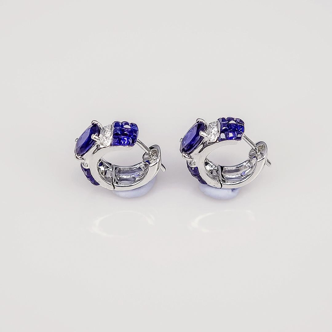 A small cute hoop made in sapphire .The oval sapphire is a very nice color.We use the top quality Sapphire which make in invisible setting.We set the stone in perfection as we are professional in this kind of setting more than 40 years.The invisible