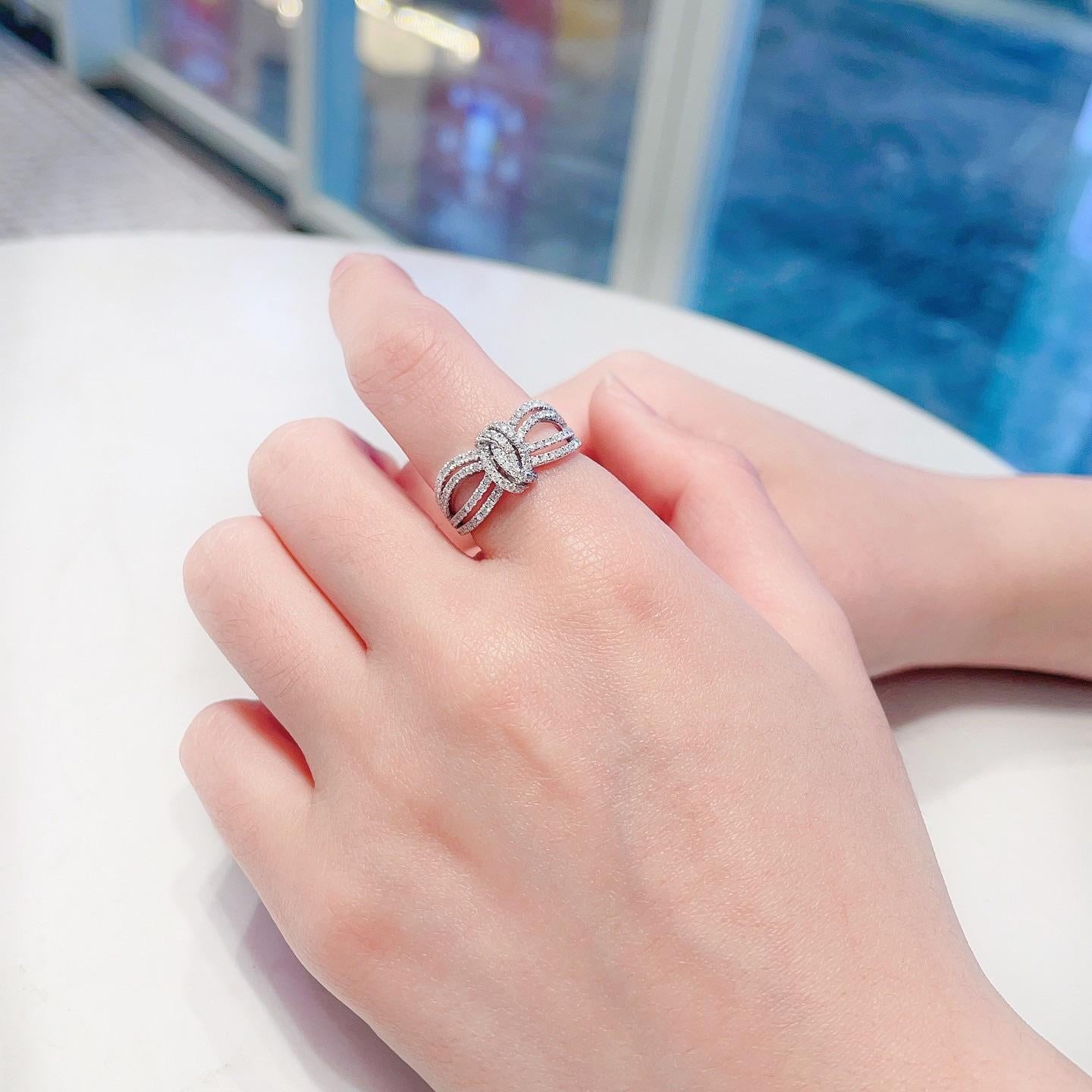 Modern 18K White Gold Knot Hollow Band Ring with Natural Diamonds For Sale