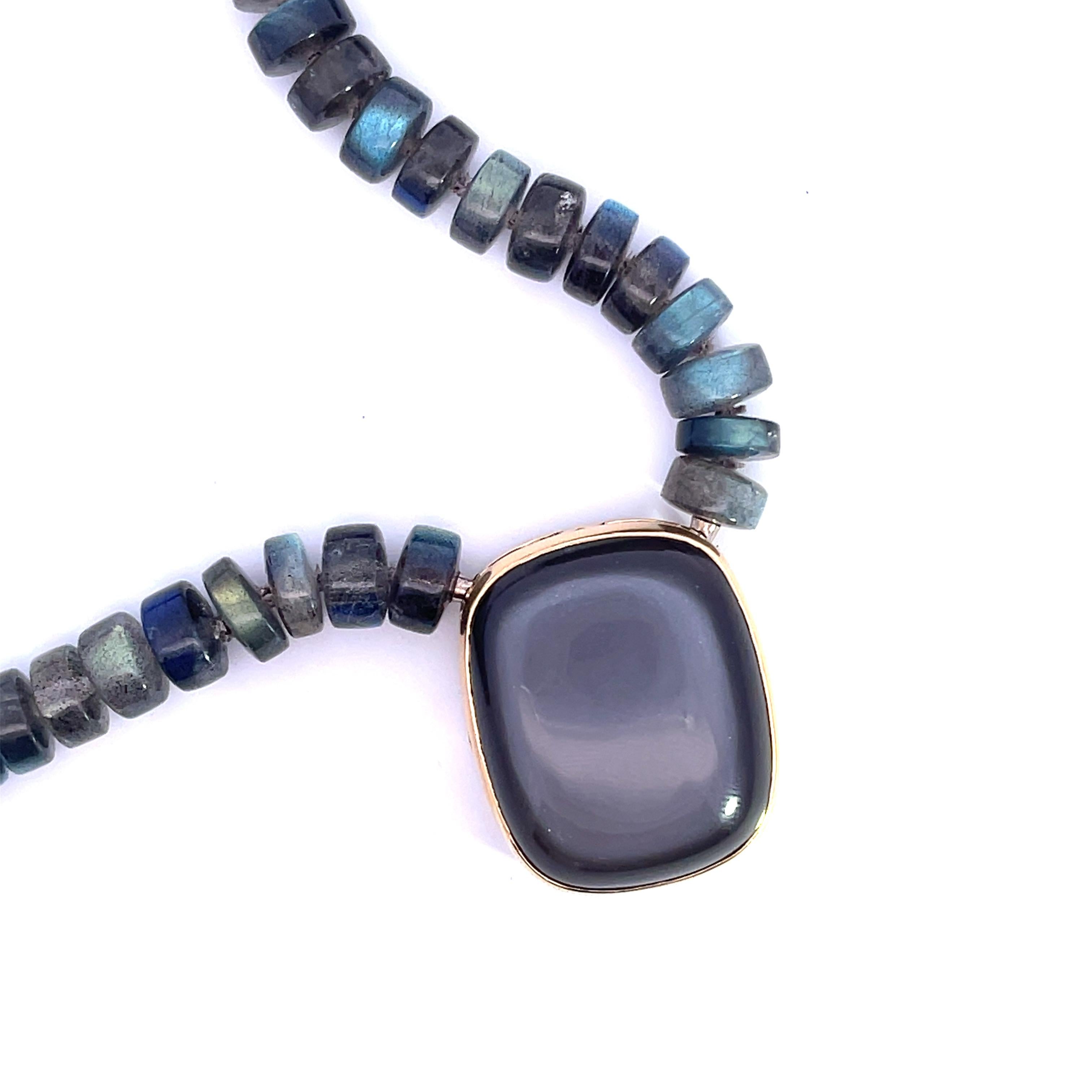 A strand of rondell-shaped labradorite with 18k white gold 