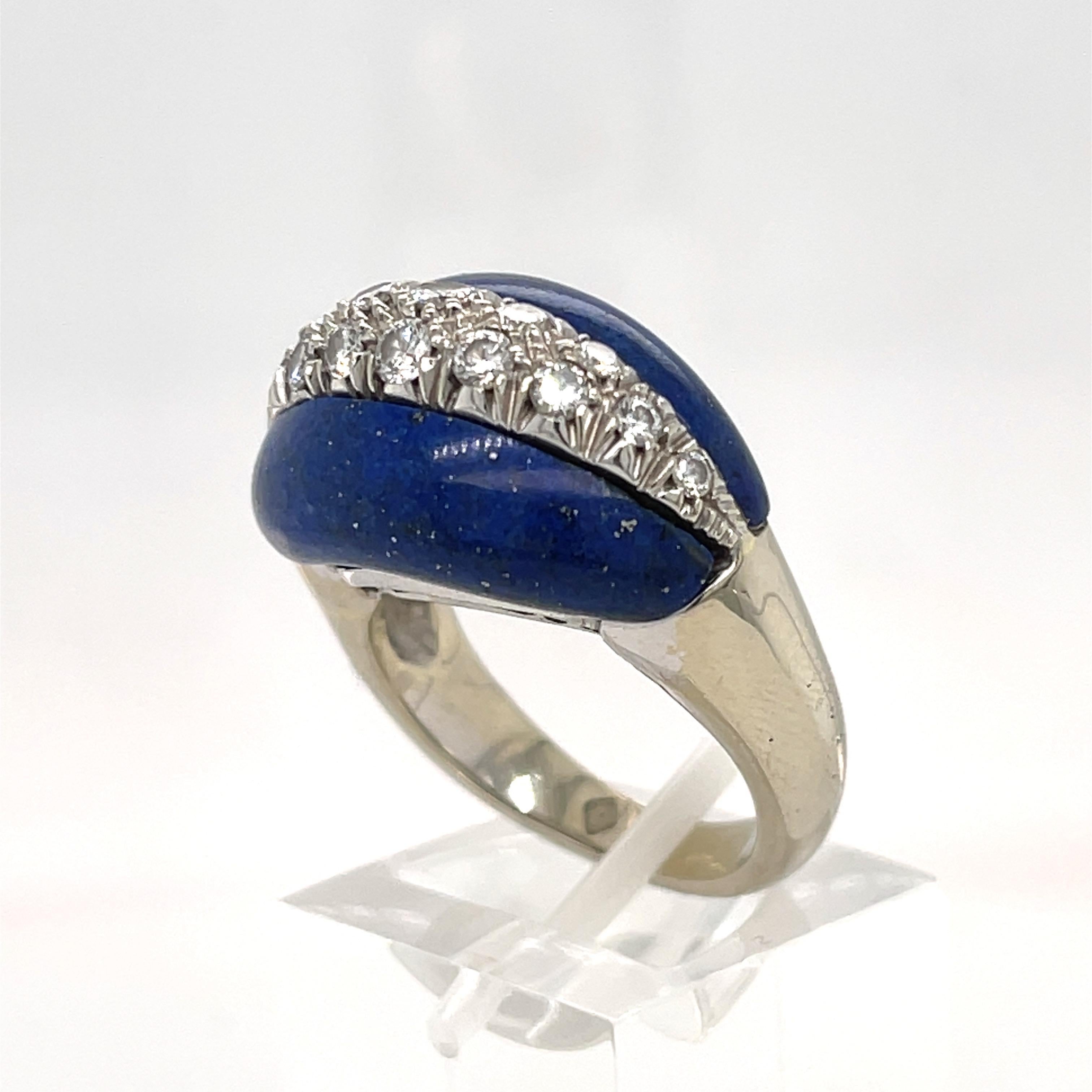 Two beautiful Lapis Lazuli pieces intersected by round Diamonds. Ring set in 18k white gold.
Marked KT18
Size 6.5