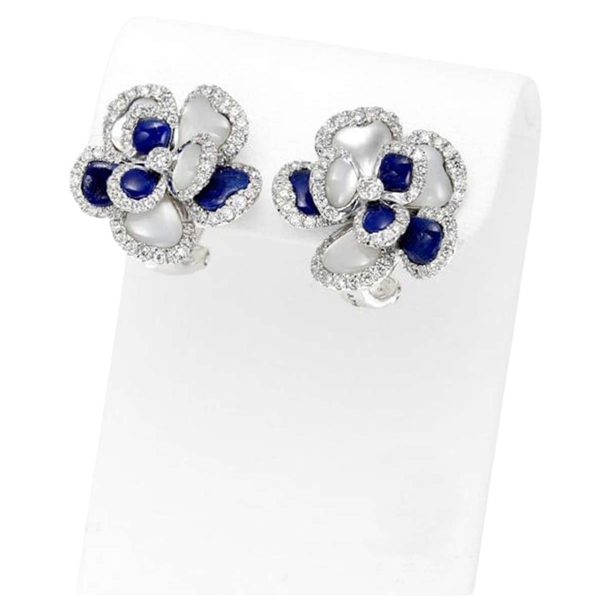 Elevate your jewelry collection with these exquisite lapis lazuli mother-of-pearl diamond earrings, crafted in luxurious 18K white gold. These earrings are a stunning combination of sophistication and elegance, featuring captivating lapis lazuli