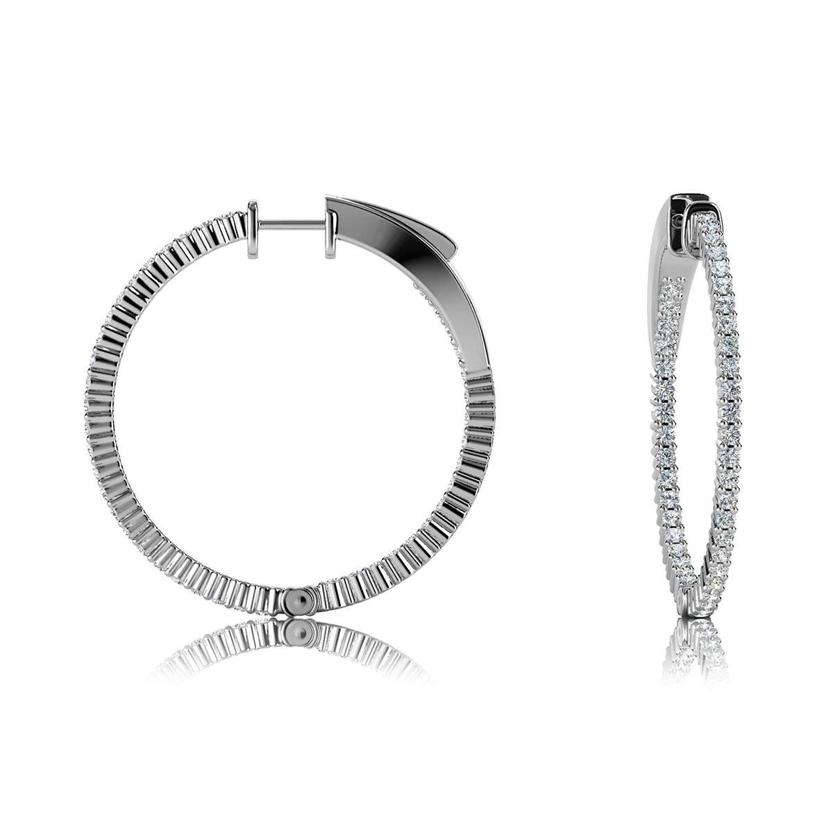 This hoop earring features round brilliant diamonds micro-prong set. The diamonds are set throughout the earrings outside and on the inner side. It's 1.2 inch in diameter. Experience the difference!

Product details: 

Center Gemstone Color: