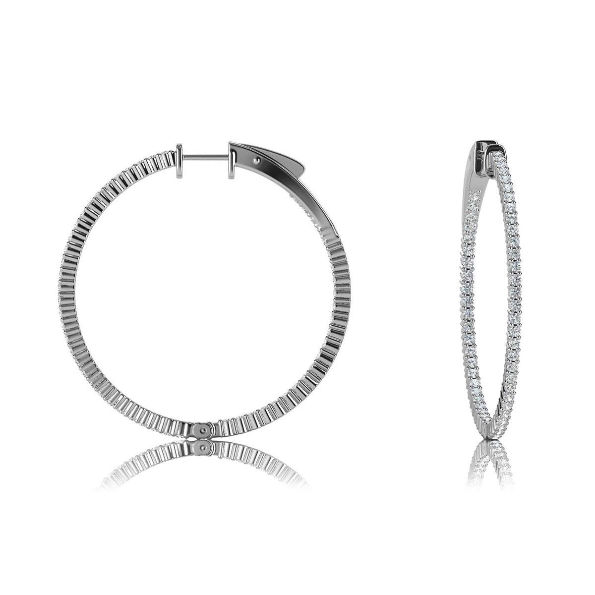 This hoop earring features round brilliant diamonds micro-prong set. The diamonds are set throughout the earrings outside and on the inner side. It's 1.5 inch in diameter. Experience the difference!

Product details: 

Center Gemstone Color: