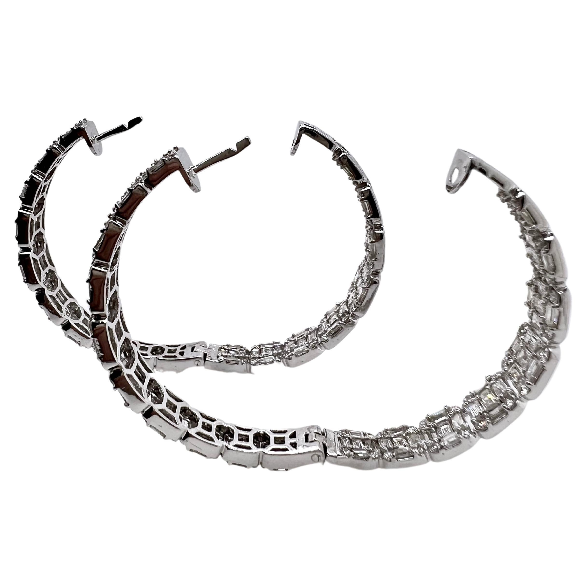 These absolutely stunning earrings have diamonds on the outer part of the hoop as well as the inside part.  The baguettes and round brilliant diamonds are arranged to make a beautiful pattern that will glisten and be seen by everyone. Ideal for