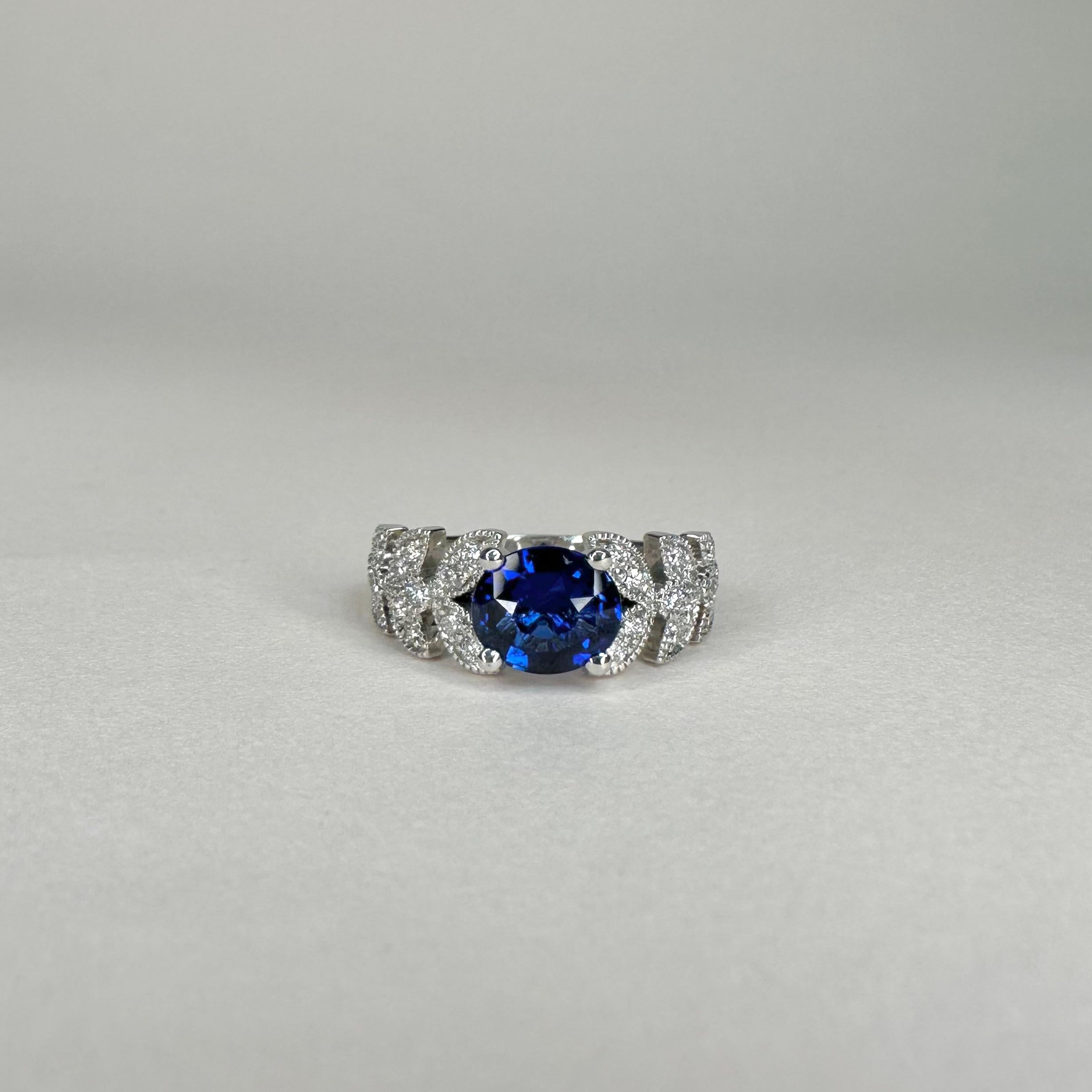 For Sale:  18k White Gold Laurel Leaf Design Ring Set with 1.53 Ct Royal Blue Oval Sapphire 2