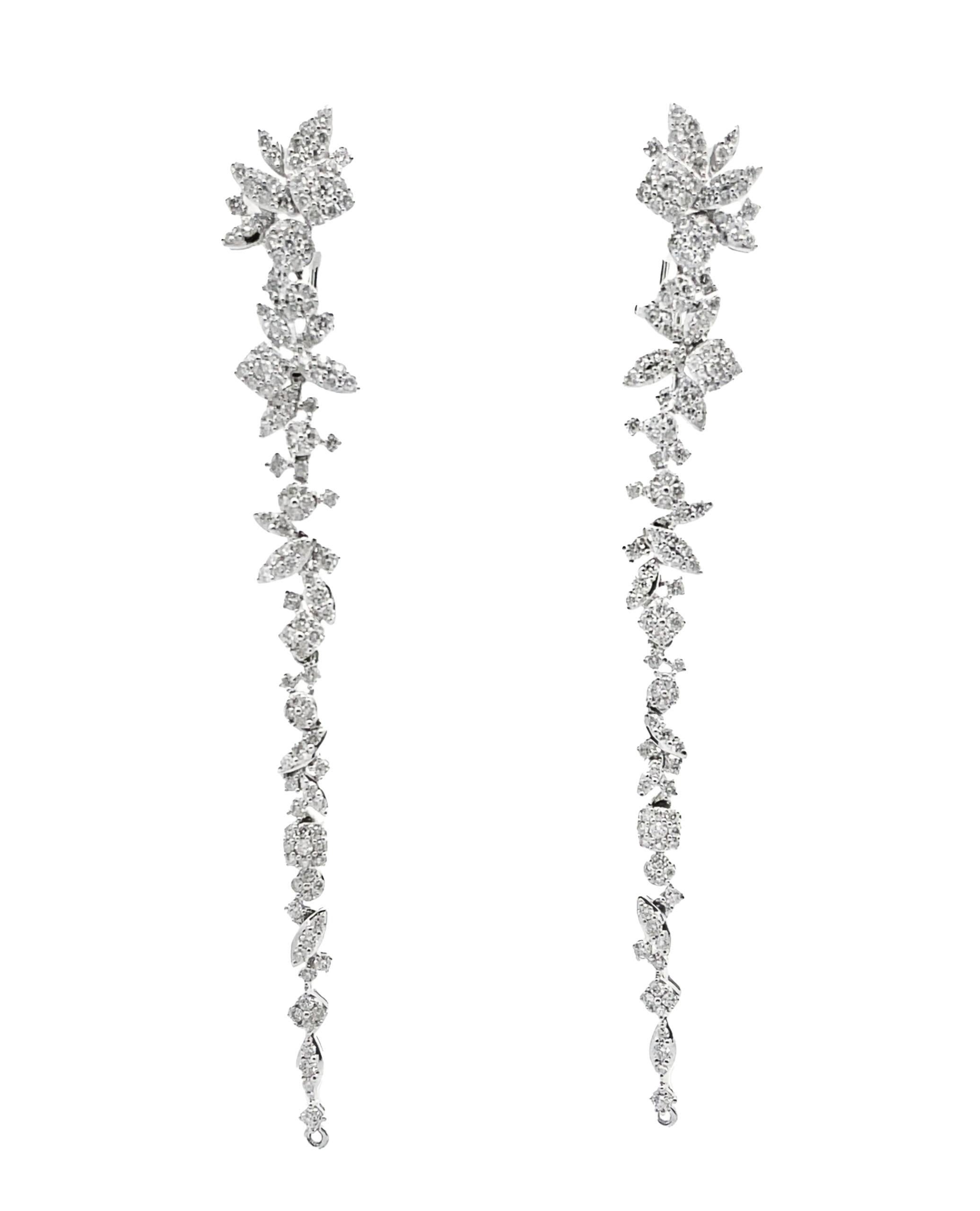 Versatile and unique 18K white gold earrings with 274 round brilliant-cut diamonds weighing 3.13 carats total. May be worn straight long or clipped short pear shape. 

- Diamonds are G/H color, SI clarity.
- 3.5 inches long when worn straight.
-