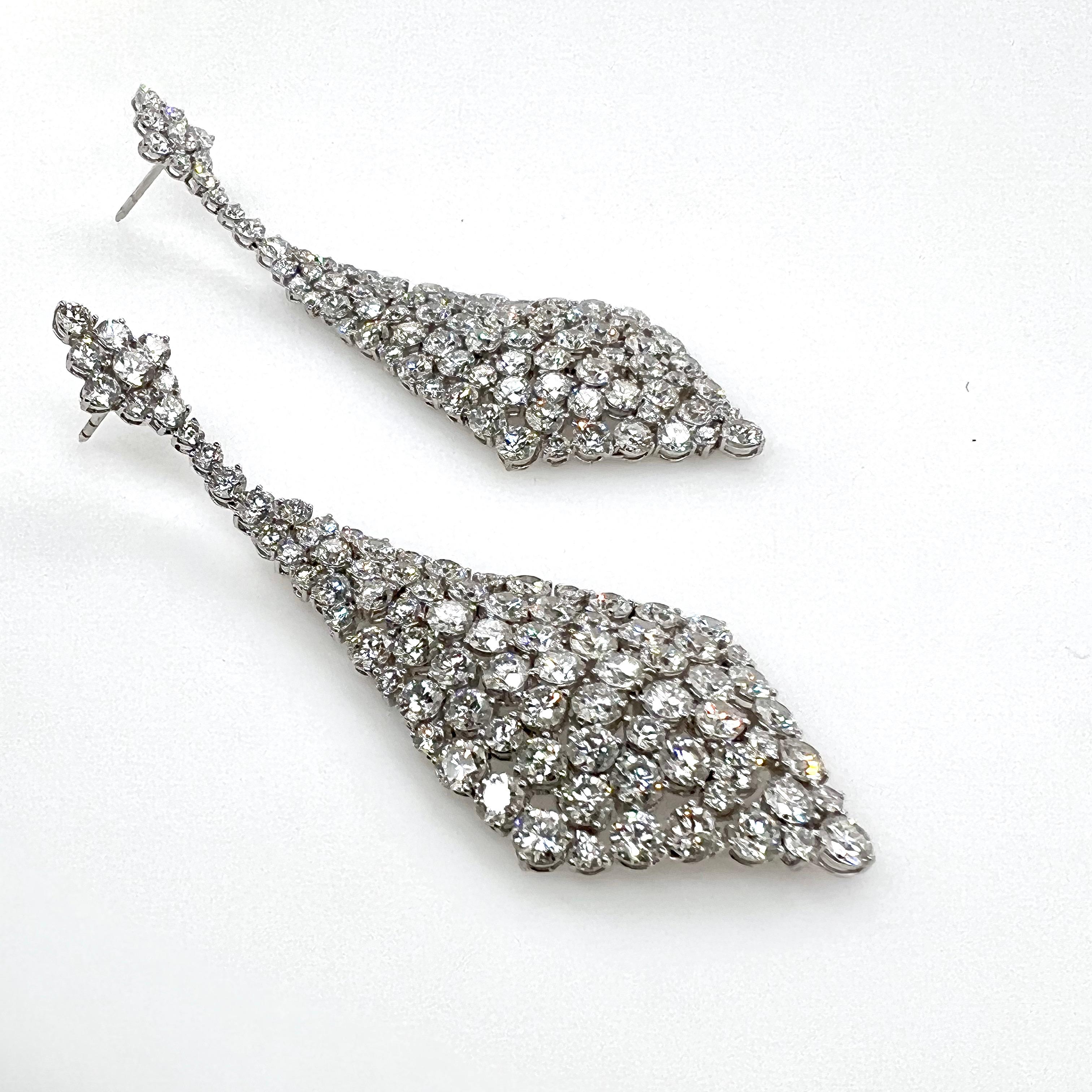 This elongated diamond dangle earrings area collectible to any jewelry collection!  It boasts over 20 carats of diamonds in stunning graduated, 3 inch design from top to bottom.  These will make all ears look like a piece of art!

Metal:  18k White