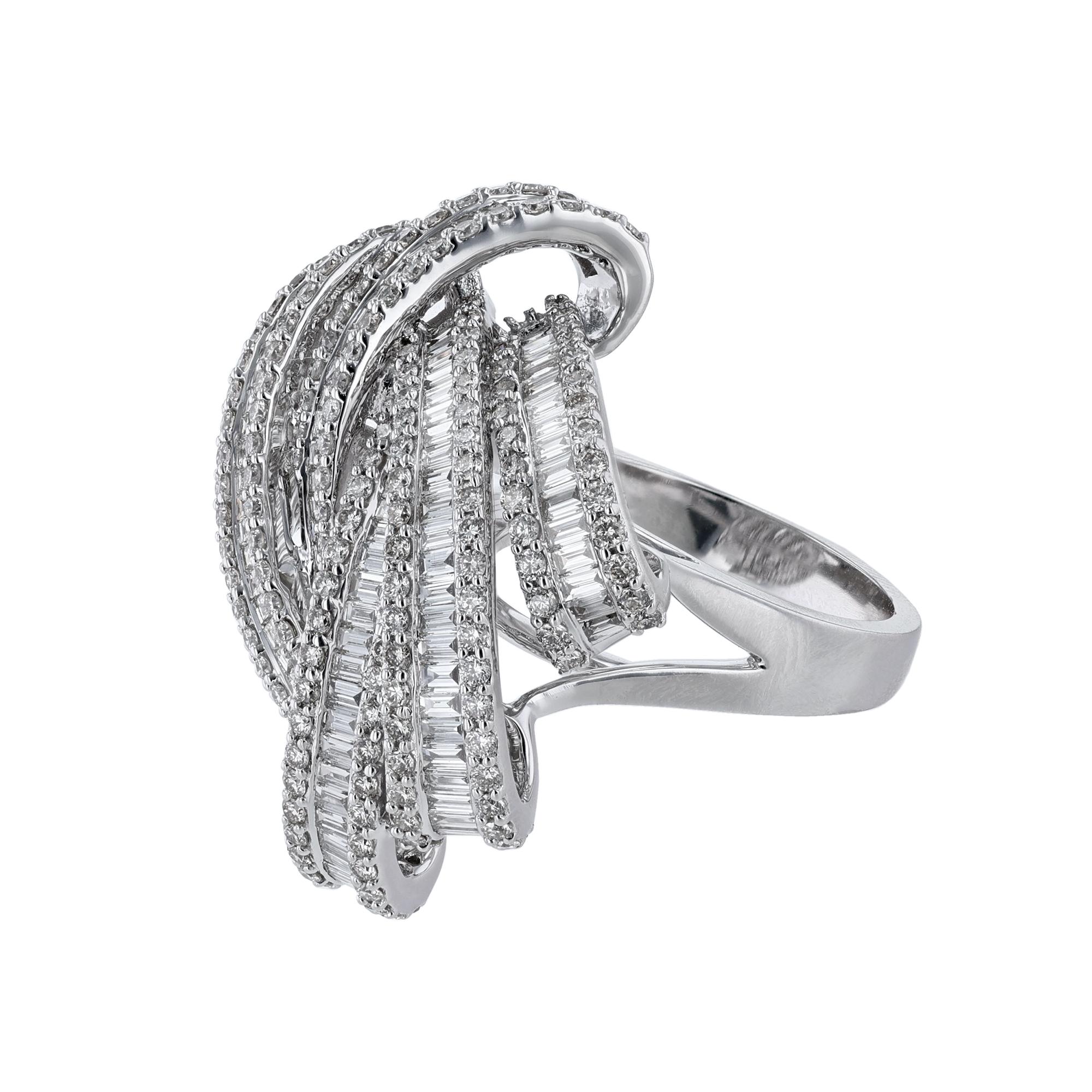This ring is made in 18K white gold. It features 197 round cut, prong set diamonds weighing 1.64 carats. Along with 121 tapered baguette cut, channel set diamonds weighing 1.99 carats. With a color grade (H) and clarity grade (SI2). 

