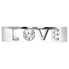 Pulsera de oro blanco de 18 quilates "LOVE" grabada con diamante solitario