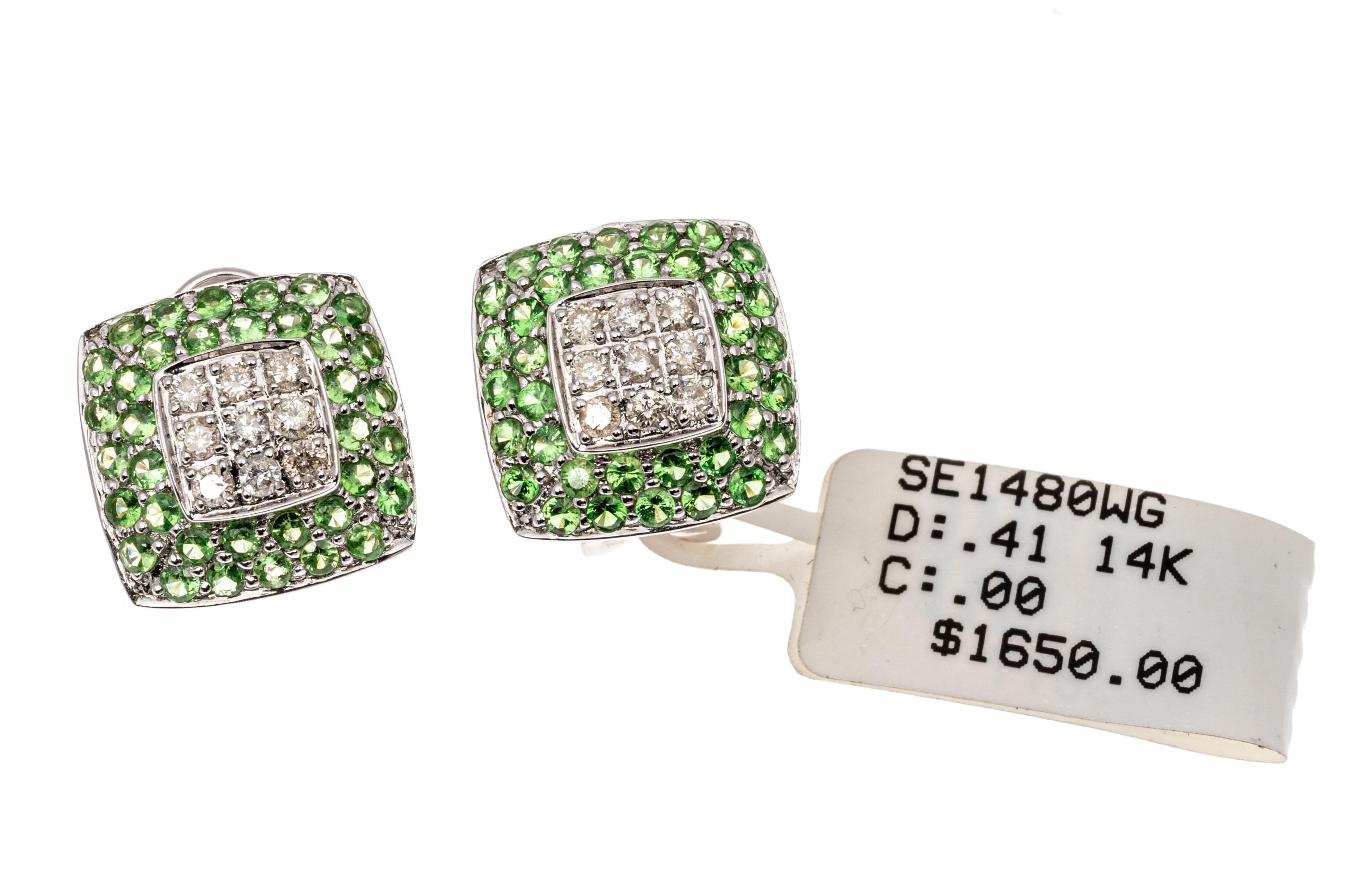 18k white gold earrings. These magnificent earrings are a square button style, set with a square center of round faceted white diamonds 0.41 TCW, bordered by round faceted light green tsavorite garnets. All of the stones are pave set, and the