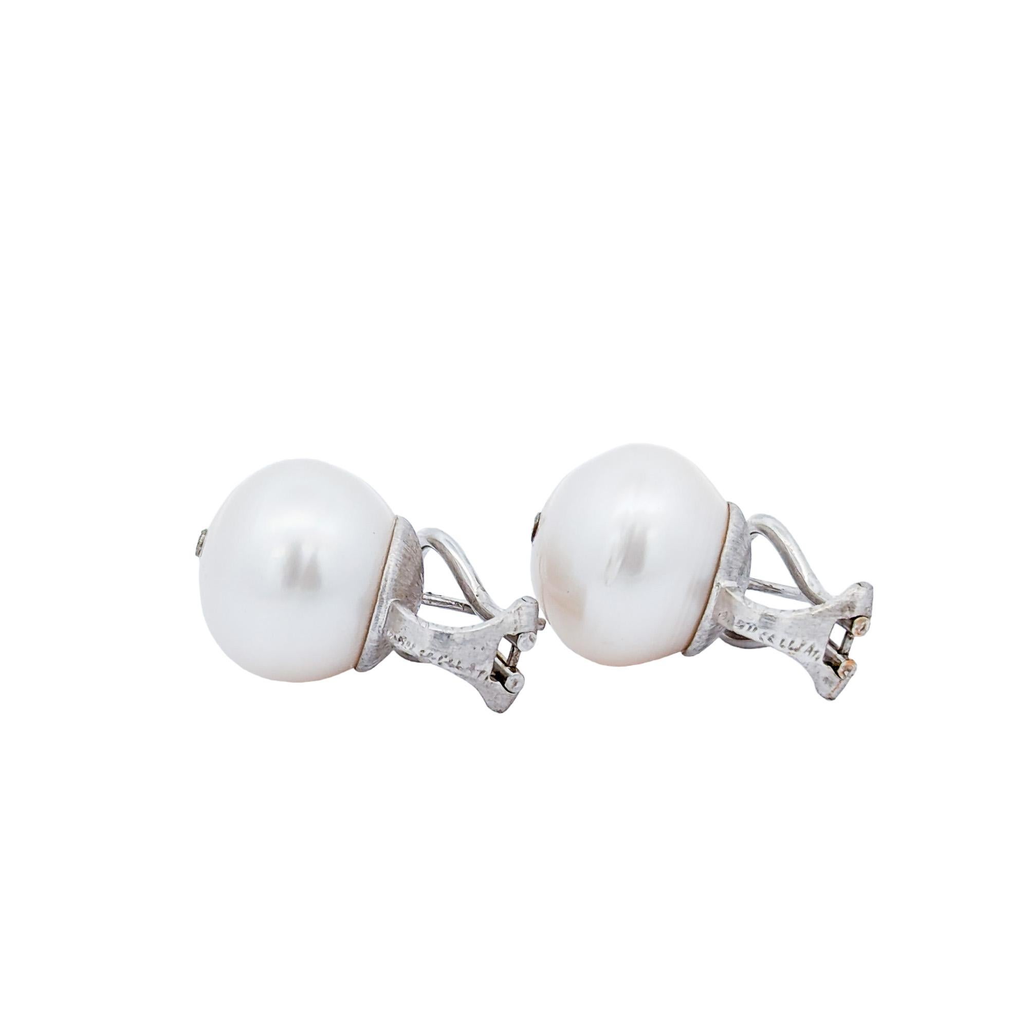 Maker: Mario Buccellati 

Period: Mid 20th Century

Metal: 18K White Gold

Pearls: Two (2) 14 mm cultured pearls 

Weight: 12.8 Grams

