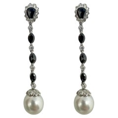 Pendientes de gota de oro blanco de 18 quilates con diamantes blancos y negros talla marquesa y pera