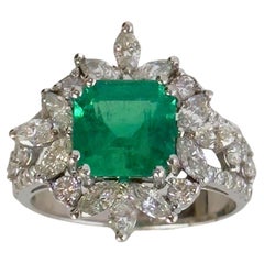 18k White Gold Marquise Cut Diamond and Emerald Ring