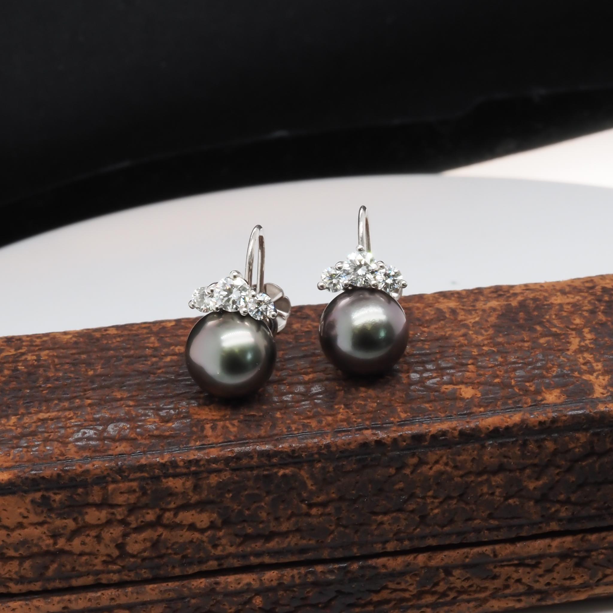 18K White Gold [Hallmarked, and Tested]
Weight: 5.3 grams
Diamond:
Weight: .70ct, total weight
Cut: Round Brilliant
Color: E-F
Clarity: VS
Pearl:
Size: 9.2mm each
Type: Tahitian Pearls

Price: 3000