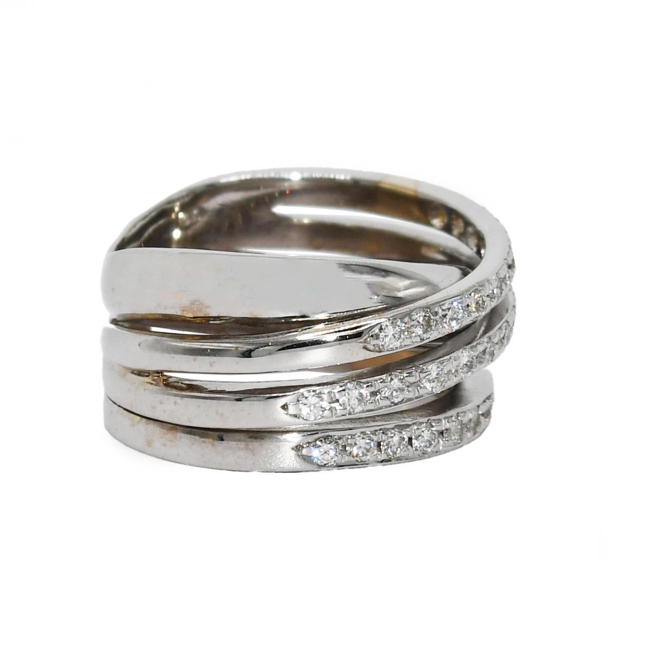 Ladies multi-band diamond ring with 18k white gold setting.
The ring tests 18k using an electronic tester.
The gross weight is 9.4 grams.
The diamonds are round brilliant cuts, .50 total carats, h, i, j color range, Vs clarity.
The ring measures