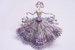 Broche "Mystère" en or blanc 18 carats, saphirs multicolores et diamants