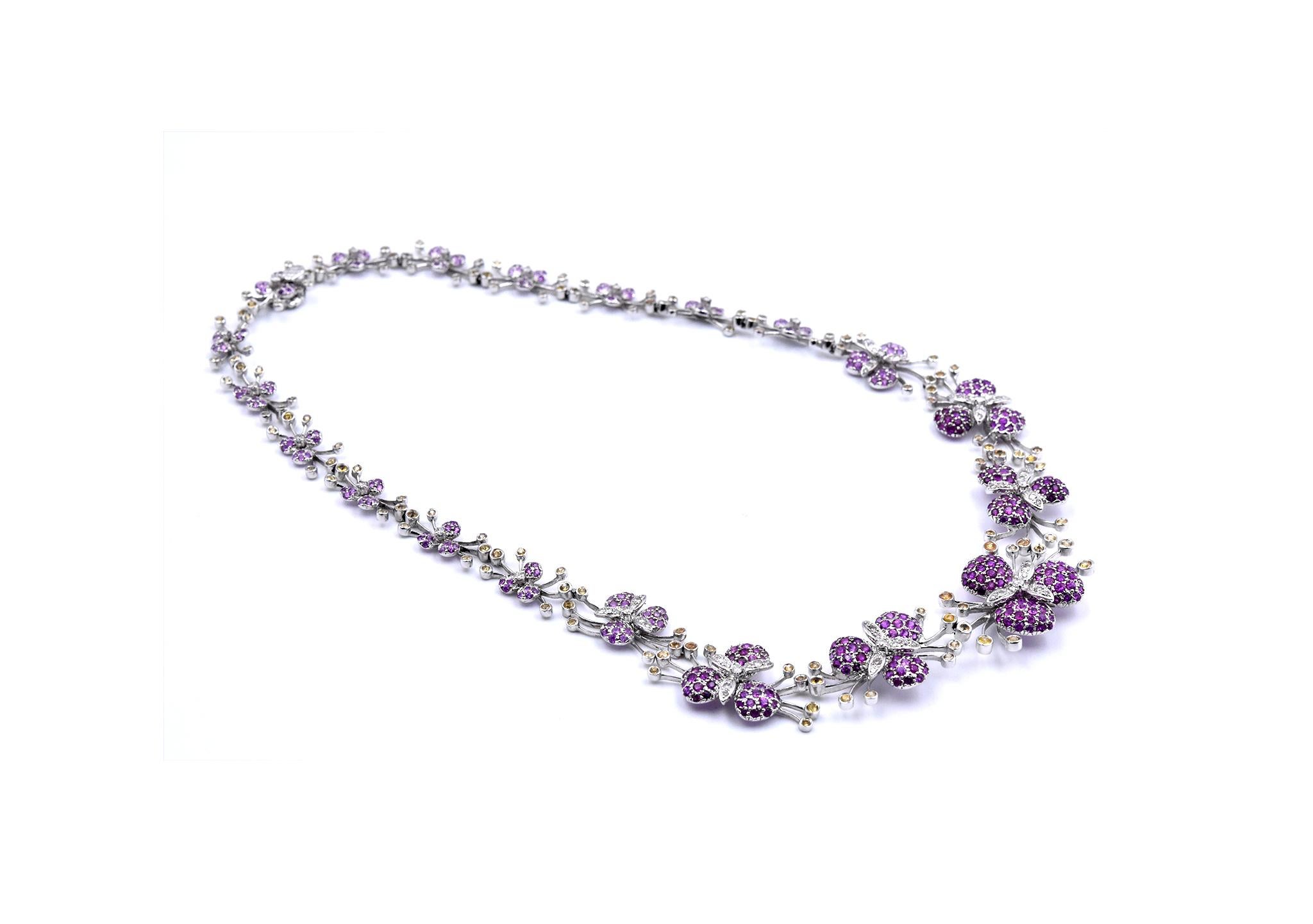Designer: custom designed
Material: 18k white gold
Sapphires: round cut green, pink, and yellow sapphires
Dimensions: necklace is 16-inches in length
Weight: 42.15 grams
