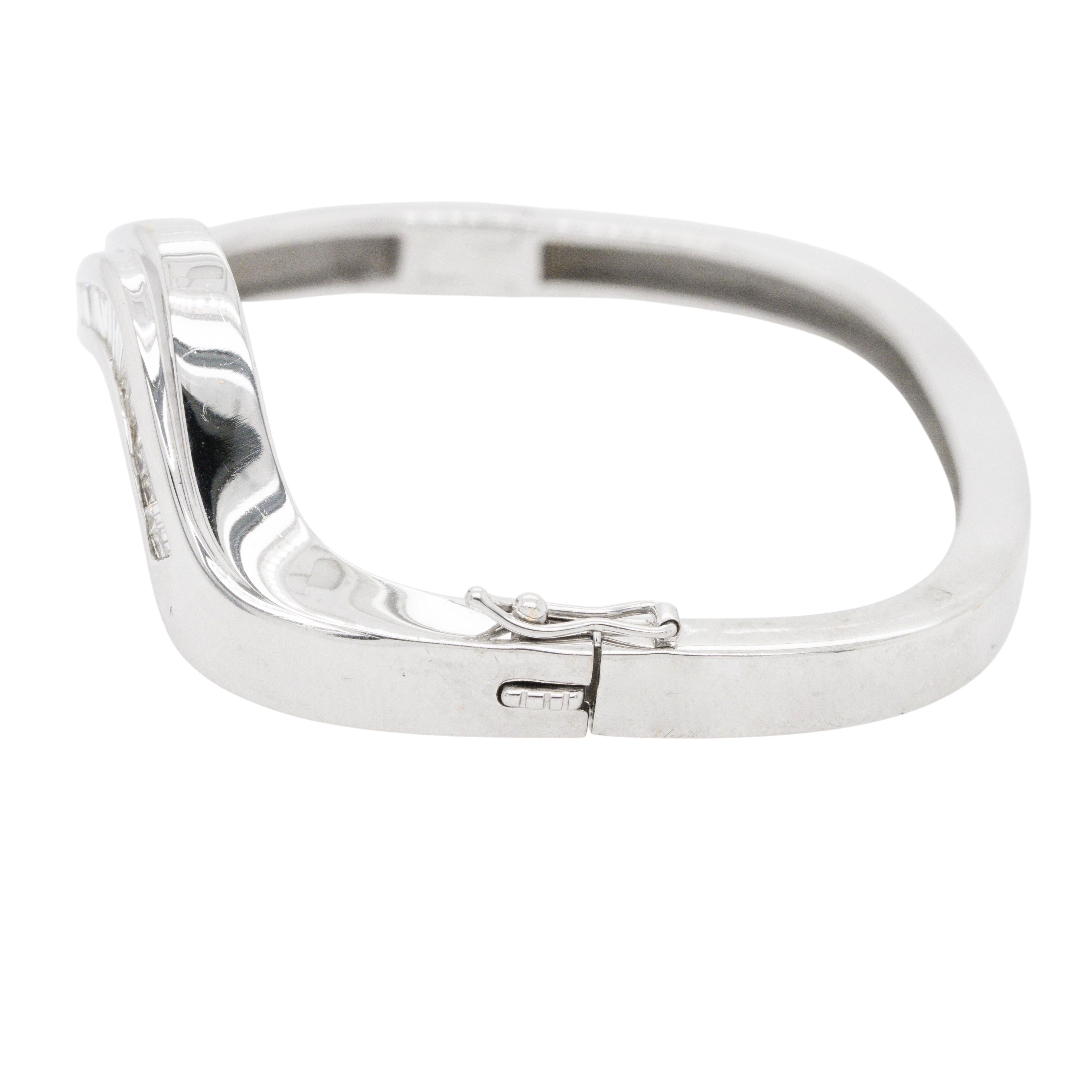 This exquisite 18k White Gold Natural Baguette Bangle Bracelet is a refined piece that sparkles with approximately 3.5 carats of H/I color, VS clarity diamonds. Crafted to fit a 6