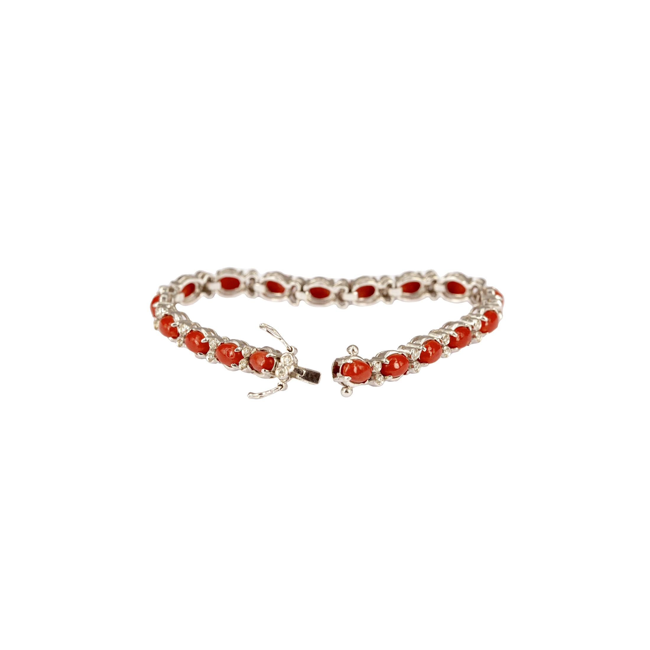 18 carat white gold tennis bracelet with 18 oval natural corals and 36 round diamonds.  
Total  length is 16cm, weight - 16gm




